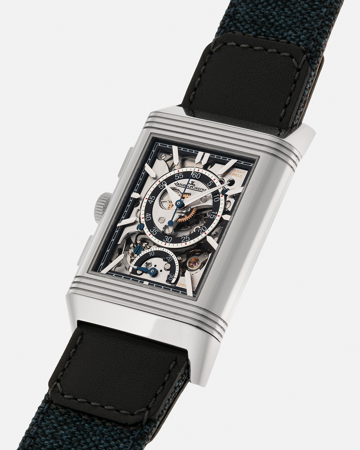 Brand: Jaeger LeCoultre
Year: 2024
Model: Q389848J, Reverso Tribute Chronograph
Reference Number: 216.8.S0
Material: Stainless Steel
Movement: Jaeger LeCoultre Cal. 860, Manual-Winding
Case Diameter:  49.9mm (Including Lugs) x 29.9mm x 11.14mm
Lug Width: 20mm
Straps: Jaeger LeCoultre Casa Fagliano Calf Leather Strap with Signed Stainless Steel Deployant Clasp, with extra  Jaeger LeCoultre Blue Canvas Strap