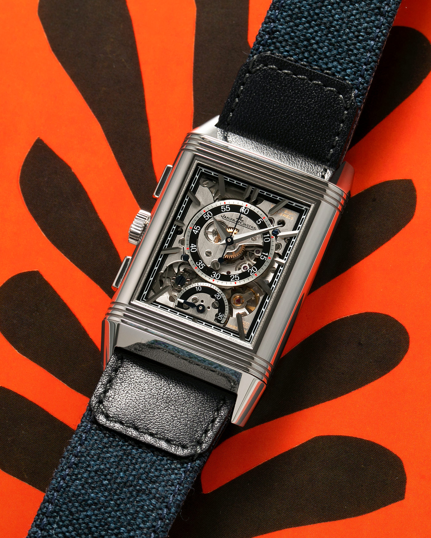 Brand: Jaeger LeCoultre
Year: 2024
Model: Q389848J, Reverso Tribute Chronograph
Reference Number: 216.8.S0
Material: Stainless Steel
Movement: Jaeger LeCoultre Cal. 860, Manual-Winding
Case Diameter:  49.9mm (Including Lugs) x 29.9mm x 11.14mm
Lug Width: 20mm
Straps: Jaeger LeCoultre Casa Fagliano Calf Leather Strap with Signed Stainless Steel Deployant Clasp, with extra  Jaeger LeCoultre Blue Canvas Strap