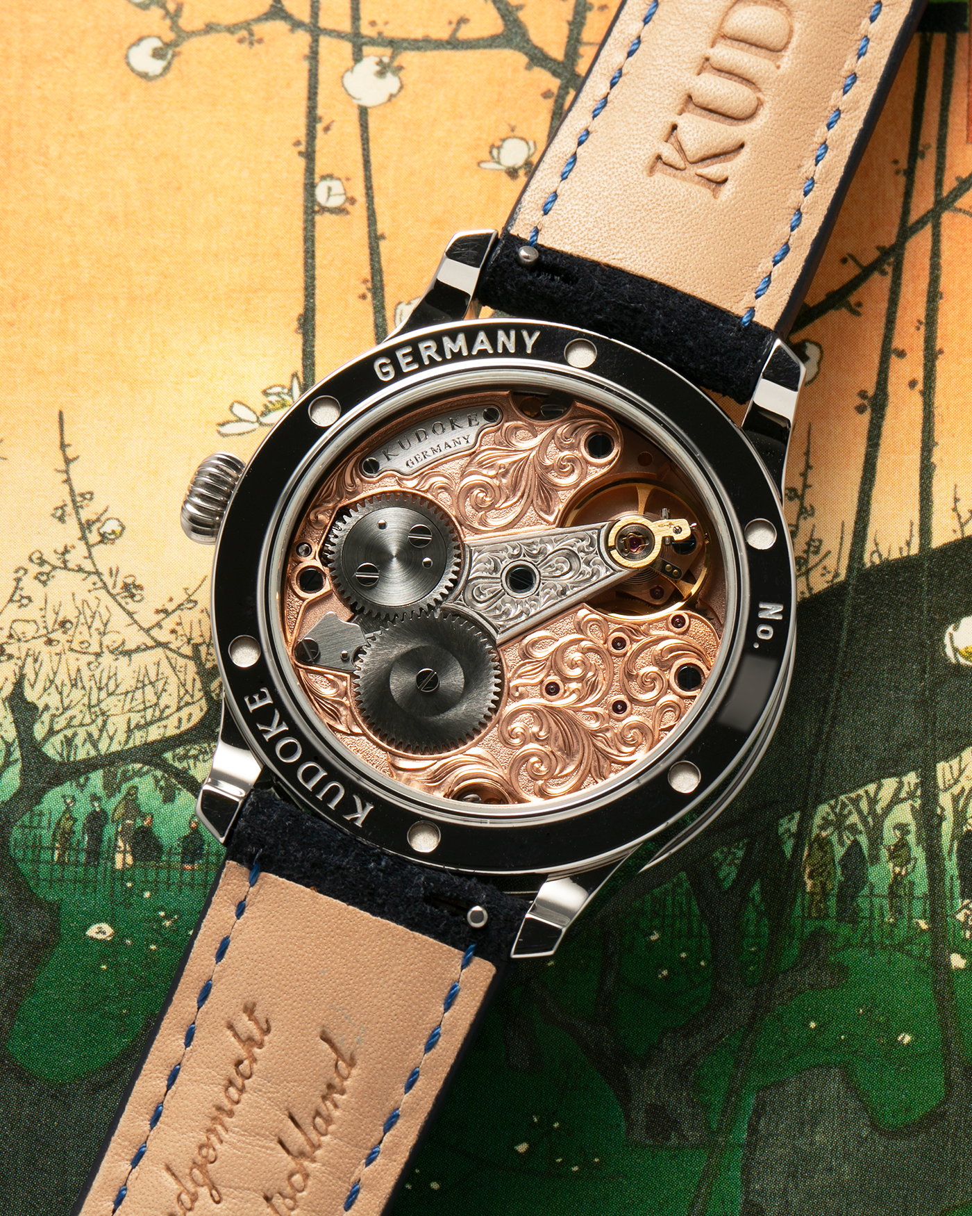 Brand: Kudoke
Year: 2022
Model: Kudoke 2 ‘Salmon’
Material: Stainless Steel
Movement: Kudoke Kaliber 1-24H, Manual-Winding
Case Dimensions: 39mm x 10.7mm (Lug-to-Lug 44mm)
Lug Width: 20mm
Strap: Kudoke Black Nubuck Leather Strap with Blue Contrast Stitching and Signed Stainless Steel Tang Buckle