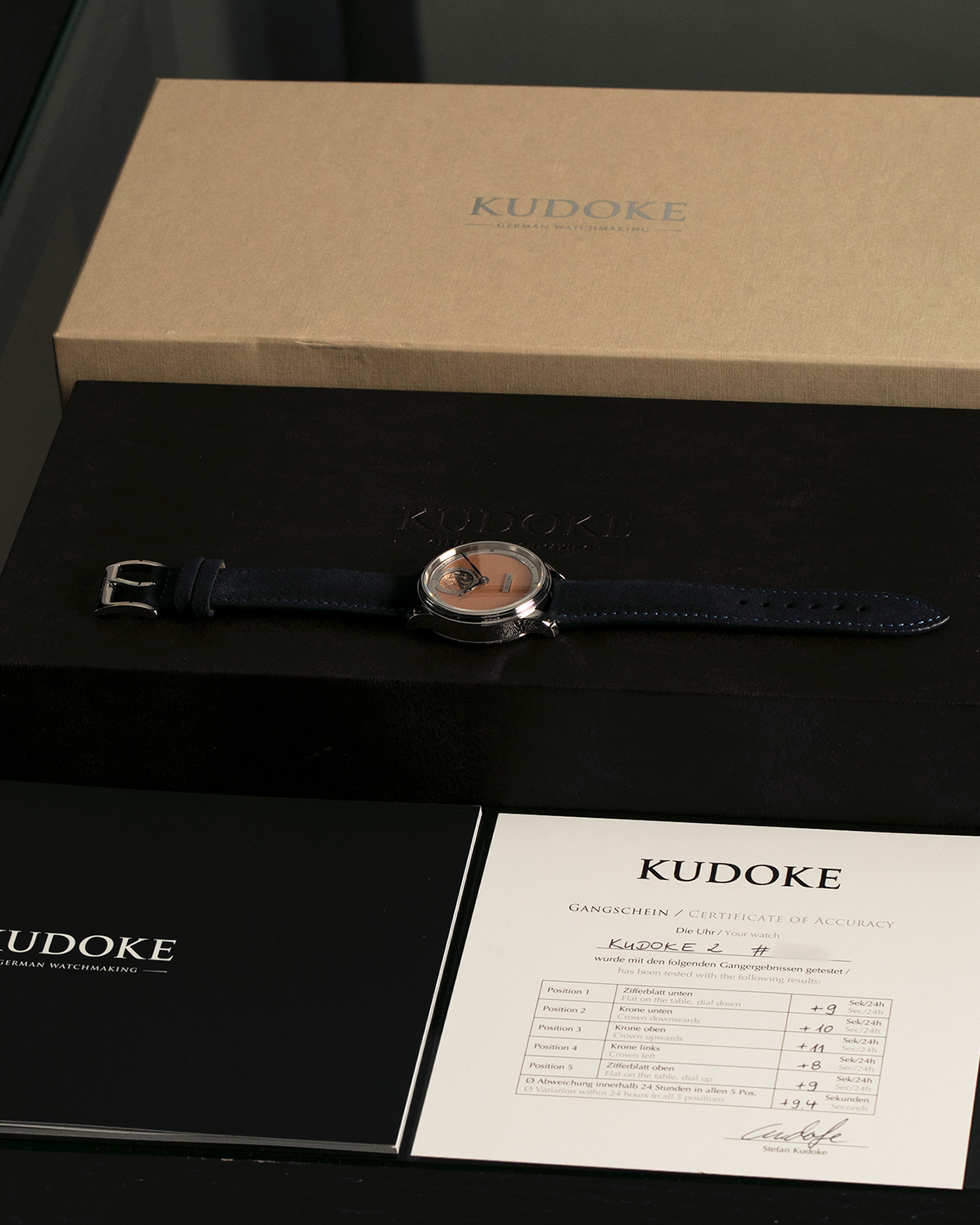 Brand: Kudoke
Year: 2022
Model: Kudoke 2 ‘Salmon’
Material: Stainless Steel
Movement: Kudoke Kaliber 1-24H, Manual-Winding
Case Dimensions: 39mm x 10.7mm (Lug-to-Lug 44mm)
Lug Width: 20mm
Strap: Kudoke Black Nubuck Leather Strap with Blue Contrast Stitching and Signed Stainless Steel Tang Buckle