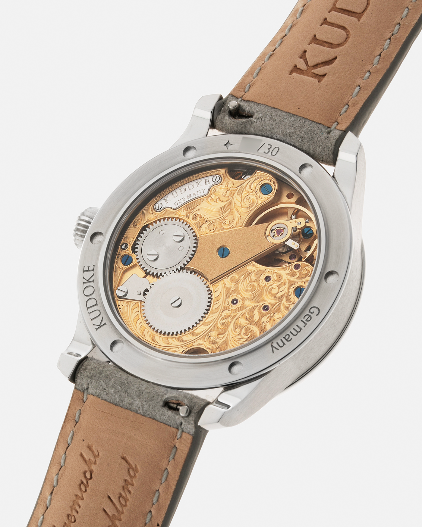 Brand: Kudoke Year: 2022 Model: Kudoke 2 ‘British Heritage’, Limited Edition of 30 pieces Material: Stainless Steel Movement: Kudoke Kaliber 1-24H, Manual-Winding Case Diameter: 39mm Lug Width: 20mm Strap: Kudoke Grey Alcantara Leather Strap with Signed Stainless Steel Tang Buckle, additional Dark Blue Alcantara Leather Strap