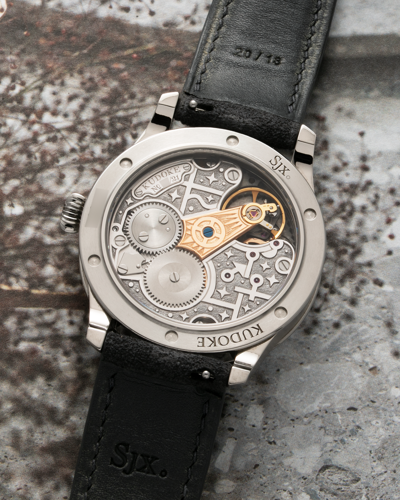 Brand: Kudoke Year: 2021 Model: Kudoke 2 ‘Zodiac’ x SJX, Limited Edition of 21 pieces (Only 12 Full Titanium Examples) Material: Grade 5 Titanium Movement: Kudoke Kaliber 1-24H, Manual-Winding Case Dimensions: 39mm x 10.7mm Lug Width: 20mm Strap: Kudoke Alcantara Grey Strap with Signed Titanium Tang Buckle