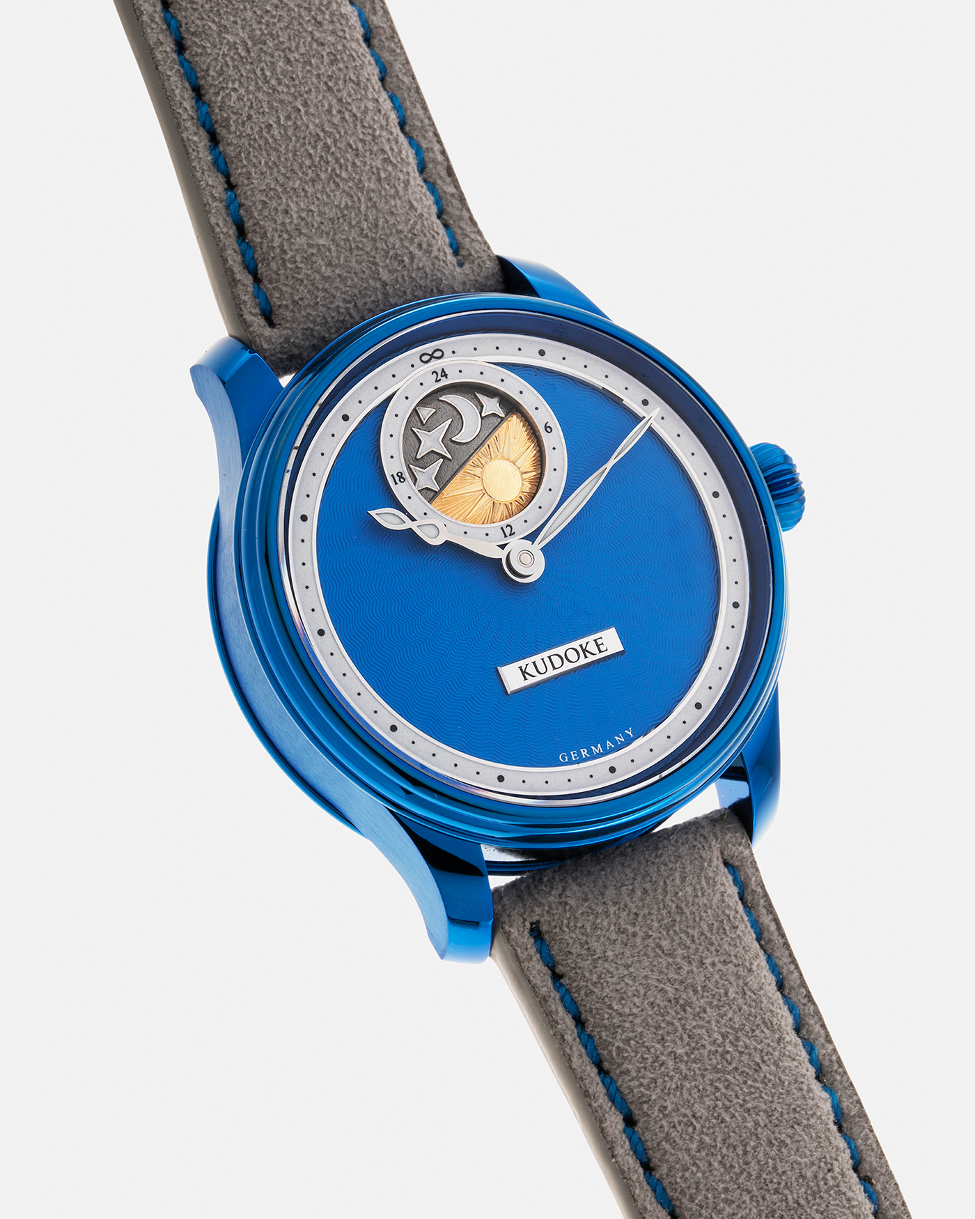 Brand: Kudoke Year: 2022 Model: Kudoke 2 ‘Starry Night’ Grail Watch 8, Limited Edition of 30 pieces Material: Grade 5 Titanium with CVD Blue Finish Movement: In-house Kaliber 1-24H, Manual-Winding Case Diameter: 39mm Strap: Grey Alcantara with Bovine Calf Lining and Blue Stitching with Signed CVD Blue Grade 5 Titanium Tang Buckle, Additional Delugs Navy CTS Rubber Strap, and Delugs Denim Bable Signature Strap