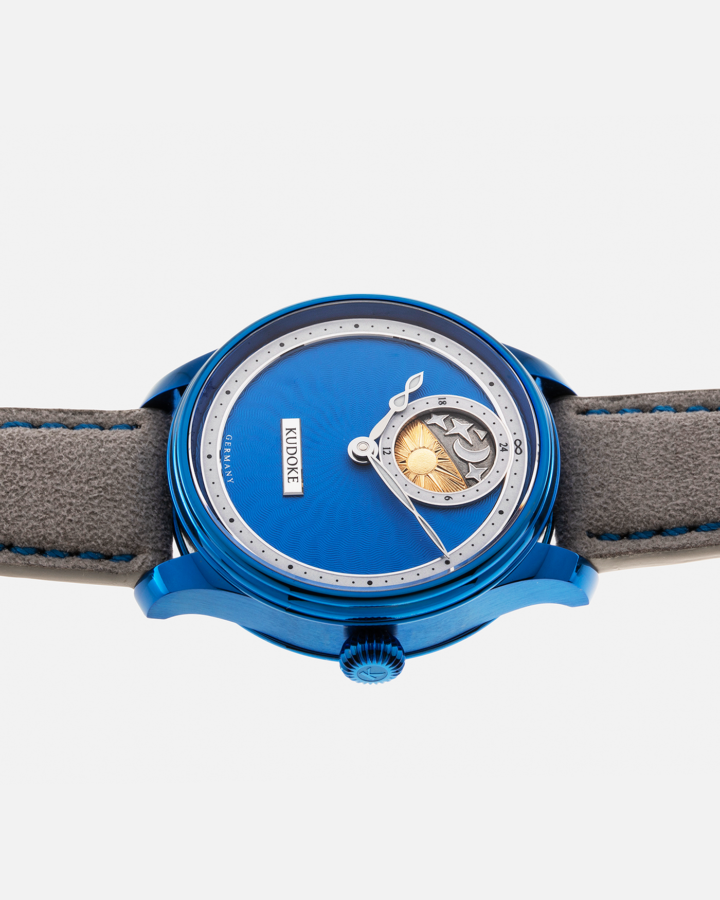 Brand: Kudoke Year: 2022 Model: Kudoke 2 ‘Starry Night’ Grail Watch 8, Limited Edition of 30 pieces Material: Grade 5 Titanium with CVD Blue Finish Movement: In-house Kaliber 1-24H, Manual-Winding Case Diameter: 39mm Strap: Grey Alcantara with Bovine Calf Lining and Blue Stitching with Signed CVD Blue Grade 5 Titanium Tang Buckle, Additional Delugs Navy CTS Rubber Strap, and Delugs Denim Bable Signature Strap