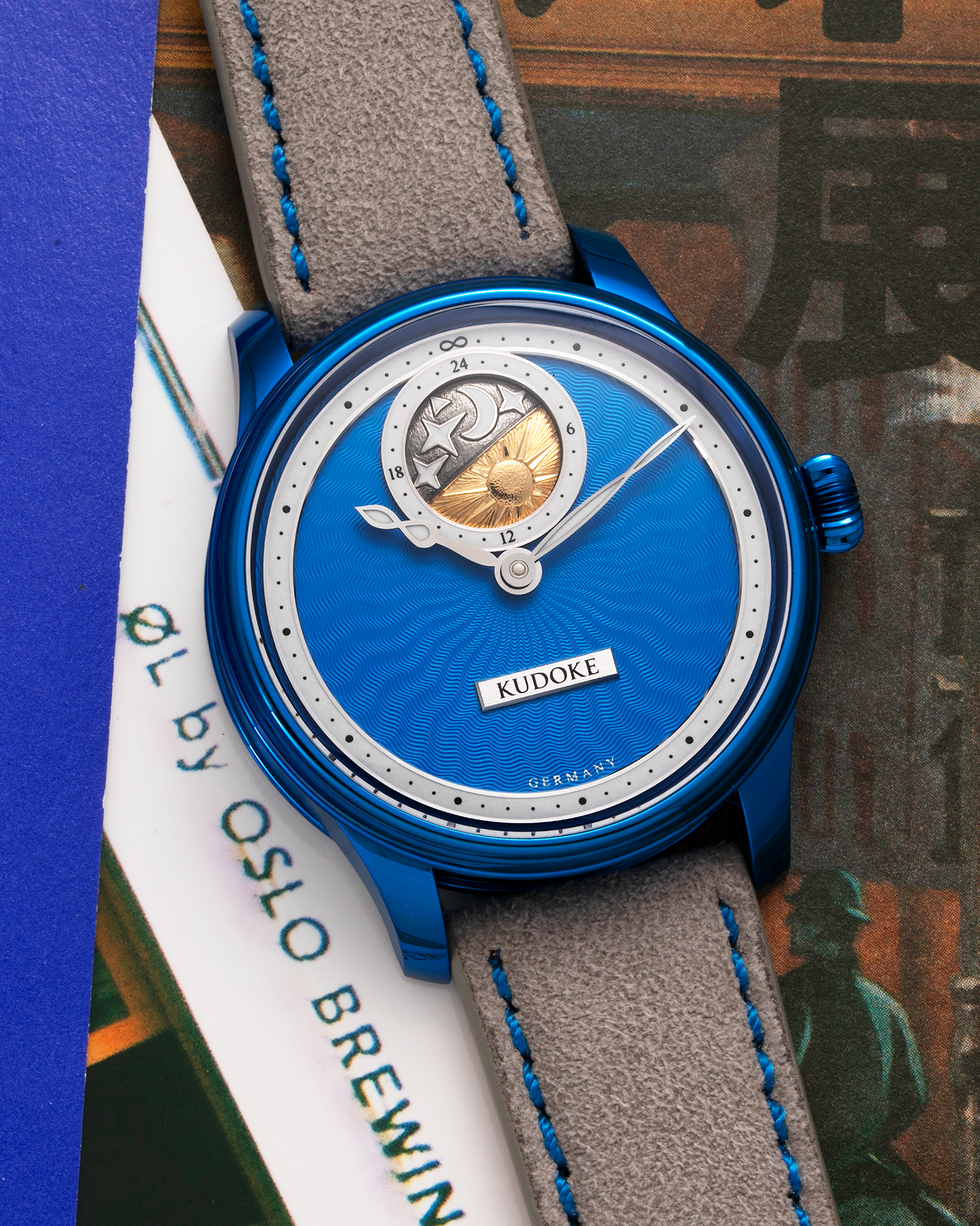 Brand: Kudoke Year: 2022 Model: Kudoke 2 ‘Starry Night’ Grail Watch 8, Limited Edition of 30 pieces Material: Grade 5 Titanium with CVD Blue Finish Movement: In-house Kaliber 1-24H, Manual-Winding Case Diameter: 39mm Strap: Grey Alcantara with Bovine Calf Lining and Blue Stitching with Signed CVD Blue Grade 5 Titanium Tang Buckle, Additional Delugs Navy CTS Rubber Strap, and Delugs Denim Bable Signature Strap