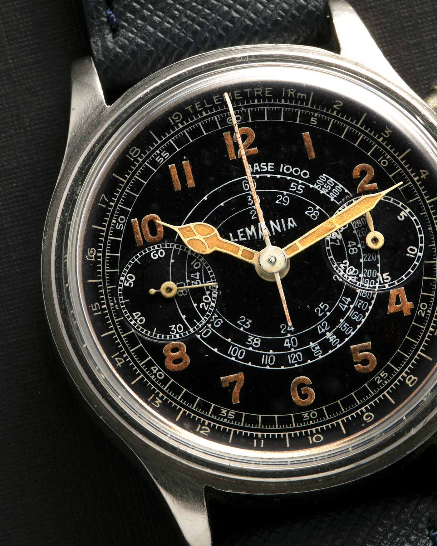 Brand: Lemania
Year: 1940’s
Model: 15TL
Material: Stainless Steel
Movement: Lemania Cal. 15TL, Manual-Winding
Case Dimensions: 38mm x 14mm (Lug-to-Lug 45.25mm)
Lug Width: 20mm
Strap: Nostime Dark Navy Textured Calf Leather Strap