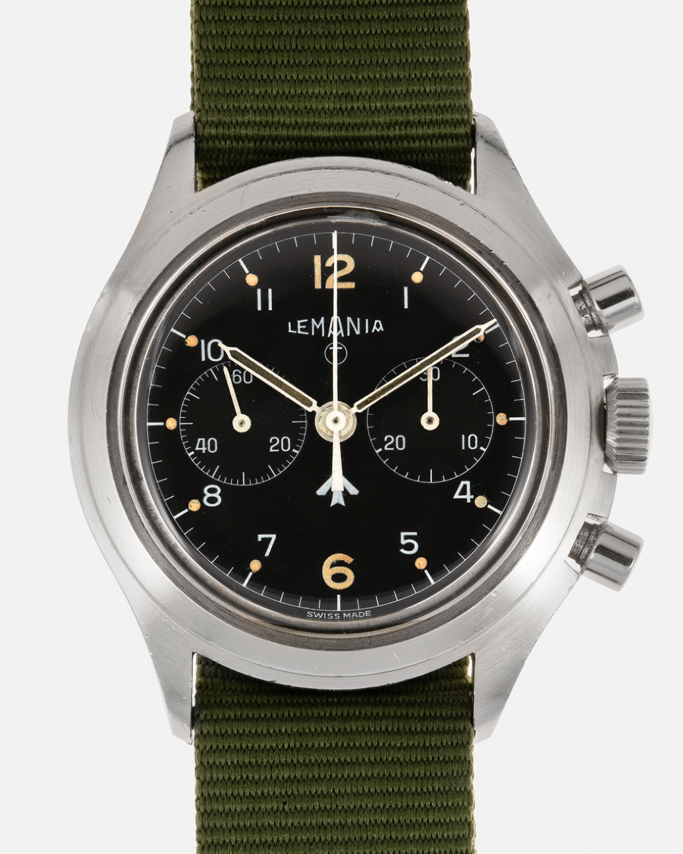 Brand: Lemania Year: 1975 Model: ‘Double Pusher’ Royal Navy Chronograph, Estimated 500 pieces only Reference Number: 818 Material: Stainless Steel Movement: Lemania 2220, Manual-Winding Case Diameter: 40mm Lug Width: 20mm Strap: Auricoste Military Green NATO Strap