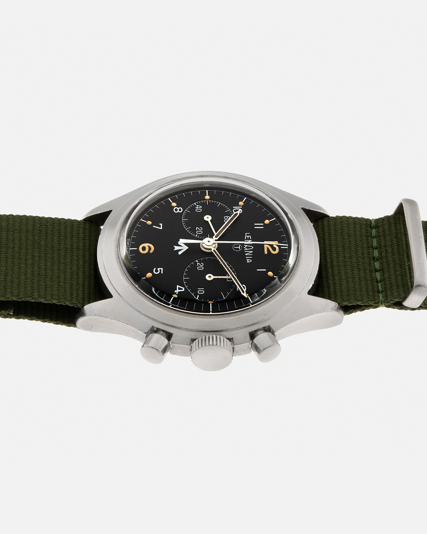 Brand: Lemania Year: 1975 Model: ‘Double Pusher’ Royal Navy Chronograph, Estimated 500 pieces only Reference Number: 818 Material: Stainless Steel Movement: Lemania 2220, Manual-Winding Case Diameter: 40mm Lug Width: 20mm Strap: Auricoste Military Green NATO Strap