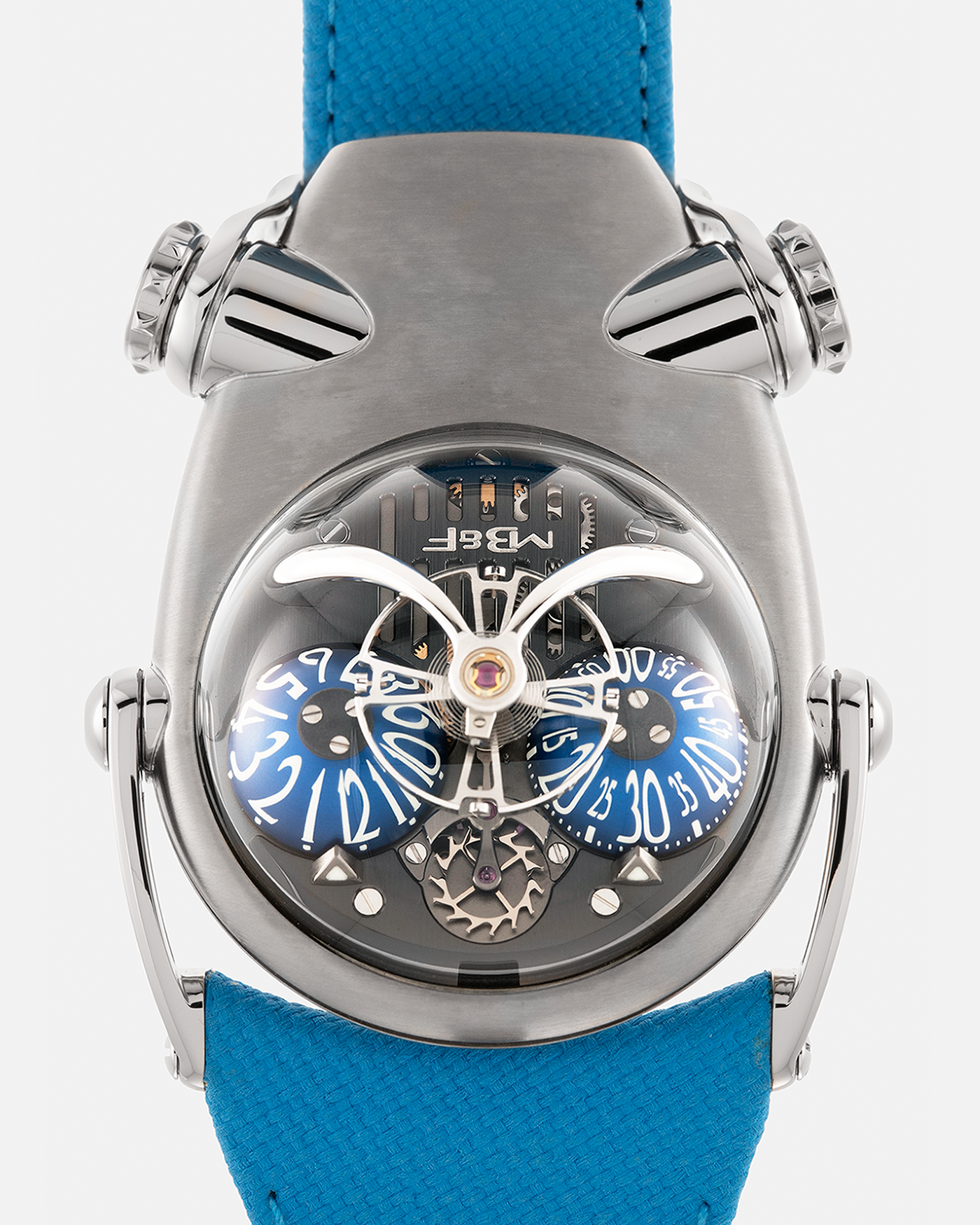 Brand: MB&F
Year: 2022
Model: HM10 ‘Bulldog’
Reference: 100.TL.BL
Material: Grade 5 Titanium
Movement: In-House Flying 14mm Balance Wheel with Four Floating Traditional Regulating Screws, Manual-Winding
Case Dimensions: 54mm (Including Lugs) x 45mm (Width) x 24mm (Height)
Strap: MB&F Proprietary Blue Calf Leather Velcro Strap with Signed Titanium Buckle