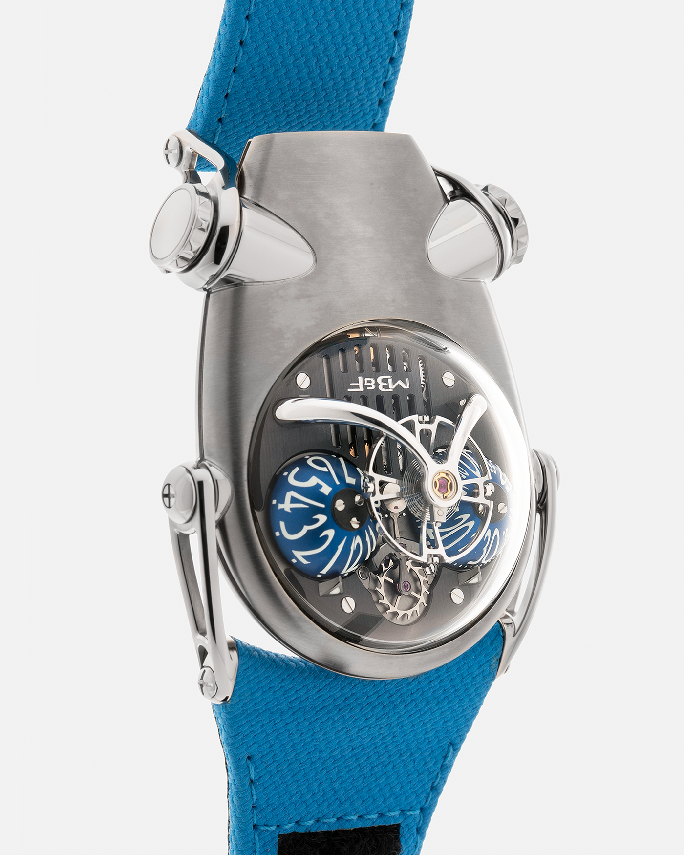 Brand: MB&F
Year: 2022
Model: HM10 ‘Bulldog’
Reference: 100.TL.BL
Material: Grade 5 Titanium
Movement: In-House Flying 14mm Balance Wheel with Four Floating Traditional Regulating Screws, Manual-Winding
Case Dimensions: 54mm (Including Lugs) x 45mm (Width) x 24mm (Height)
Strap: MB&F Proprietary Blue Calf Leather Velcro Strap with Signed Titanium Buckle