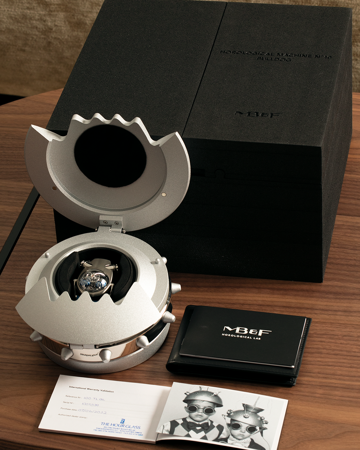 Brand: MB&F
Year: 2022
Model: HM10 ‘Bulldog’
Reference: 100.TL.BL
Material: Grade 5 Titanium
Movement: In-House Flying 14mm Balance Wheel with Four Floating Traditional Regulating Screws, Manual-Winding
Case Dimensions: 54mm (Including Lugs) x 45mm (Width) x 24mm (Height)
Strap: MB&F Proprietary Blue Calf Leather Velcro Strap with Signed Titanium Buckle