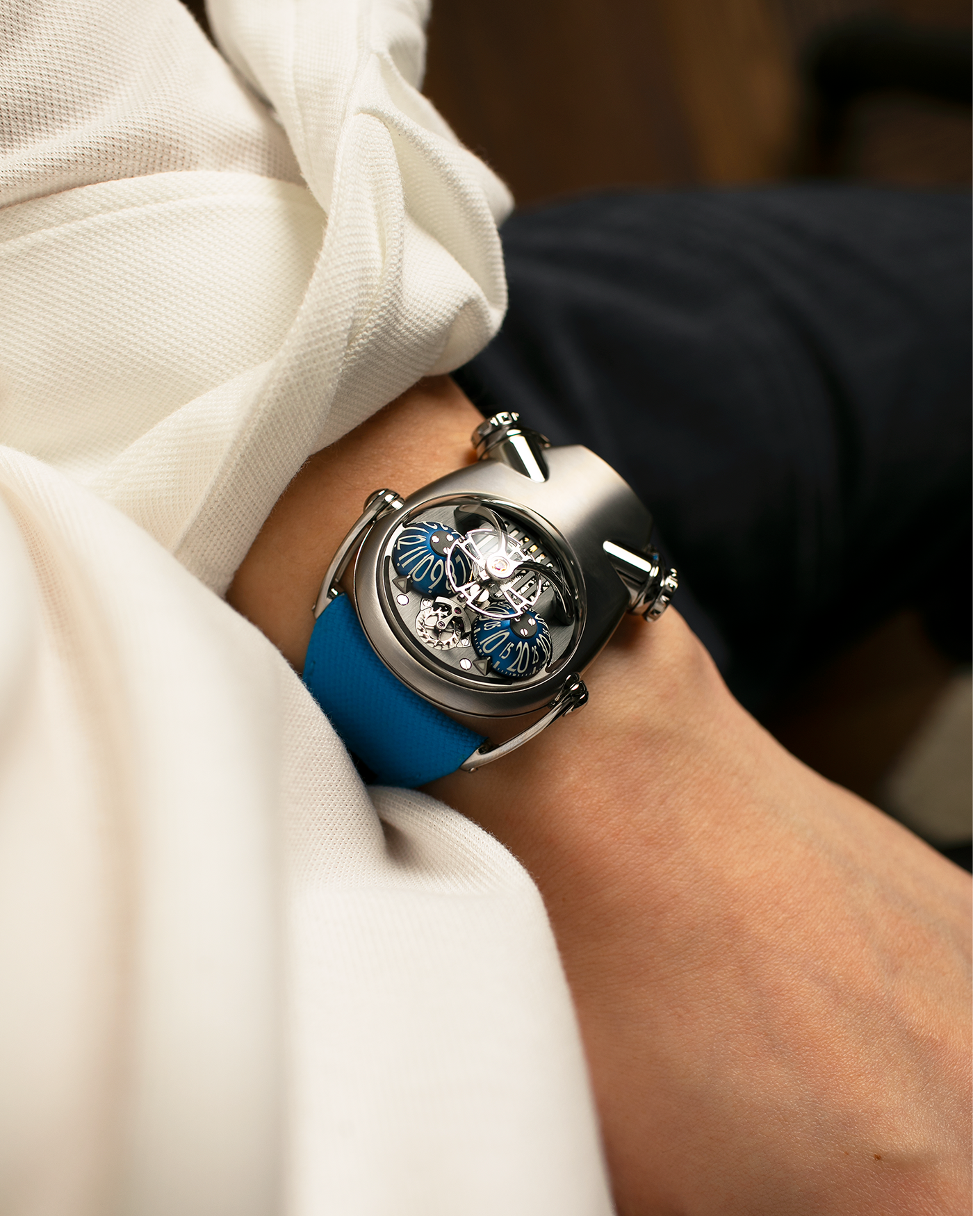 Brand: MB&F
Year: 2022
Model: HM10 ‘Bulldog’
Reference: 100.TL.BL
Material: Grade 5 Titanium
Movement: In-House Flying 14mm Balance Wheel with Four Floating Traditional Regulating Screws, Manual-Winding
Case Dimensions: 54mm (Including Lugs) x 45mm (Width) x 24mm (Height)
Strap: MB&F Proprietary Blue Calf Leather Velcro Strap with Signed Titanium Buckle