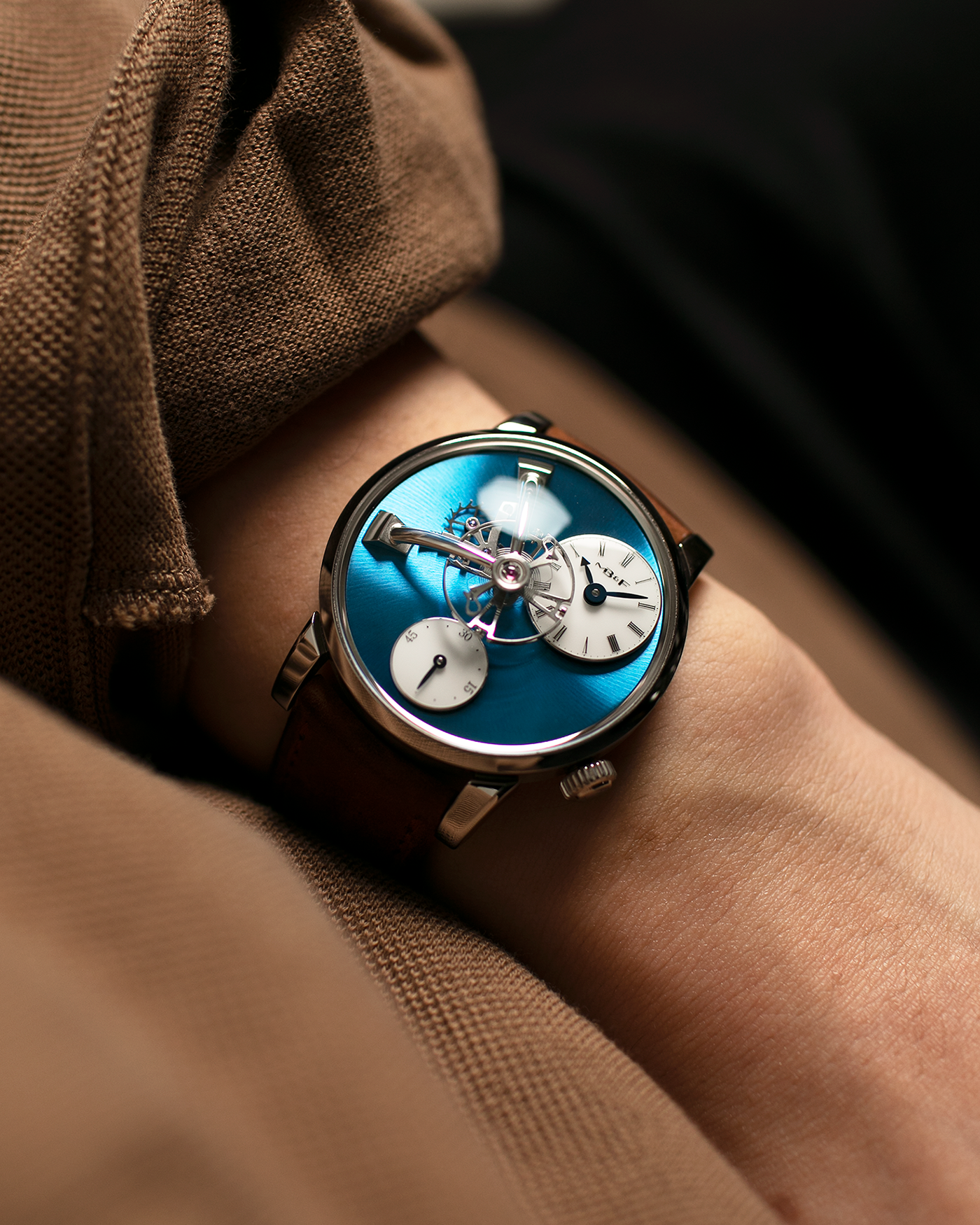 Brand: MB&F Year: 2022 Model: LM101 Steel Blue Material: Stainless Steel with Blue Baseplate Movement: In-House 3-Dimensional MB&F Caliber in Collaboration with Kari Voutilainen, Manual-Winding Case Diameter: 40mm Bracelet/Strap: MB&F Brown Suede Strap and Signed Palladium Deployant Clasp