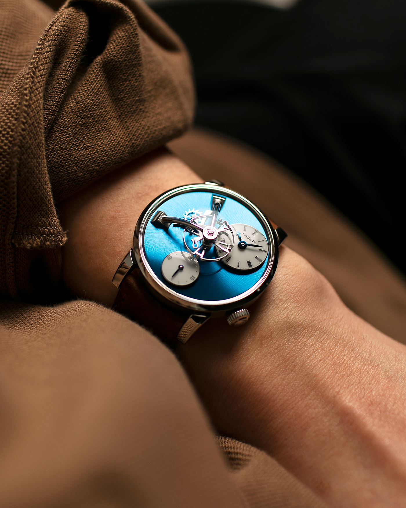 Brand: MB&F Year: 2022 Model: LM101 Steel Blue Material: Stainless Steel with Blue Baseplate Movement: In-House 3-Dimensional MB&F Caliber in Collaboration with Kari Voutilainen, Manual-Winding Case Diameter: 40mm Bracelet/Strap: MB&F Brown Suede Strap and Signed Palladium Deployant Clasp