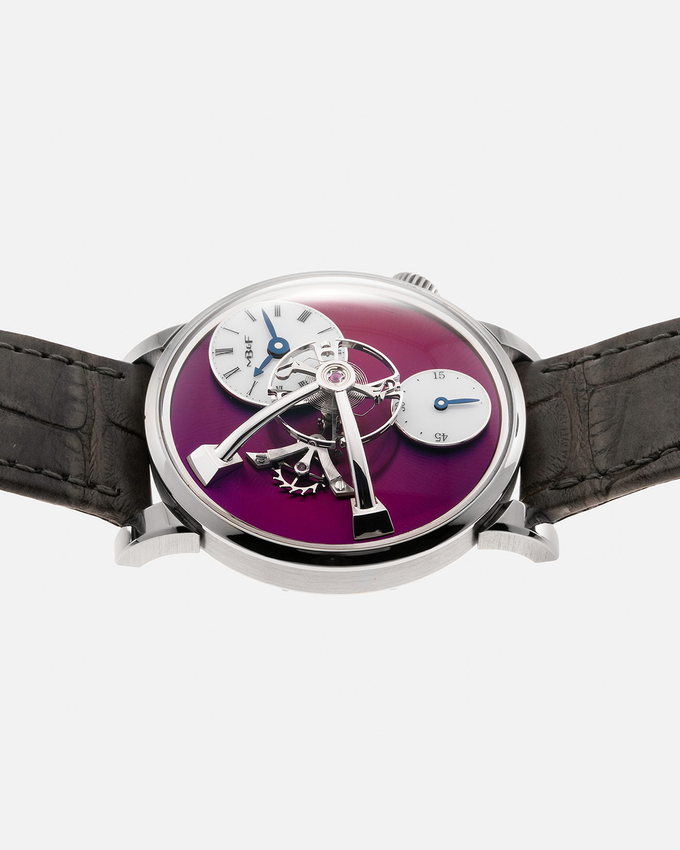 Brand: MB&F Year: 2022 Model: LM101 ‘White Gold Purple’ Reference: 51.W1L.W Material: 18-carat White Gold with Purple Baseplate Movement: In-House 3-Dimensional MB&F Caliber in Collaboration with Kari Voutilainen, Manual-Winding Case Diameter: 40mm Strap: MB&F Grey Alligator Strap and Signed Palladium Deployant Clasp, Additional MB&F Black Silicon Strap with Purple Stitching