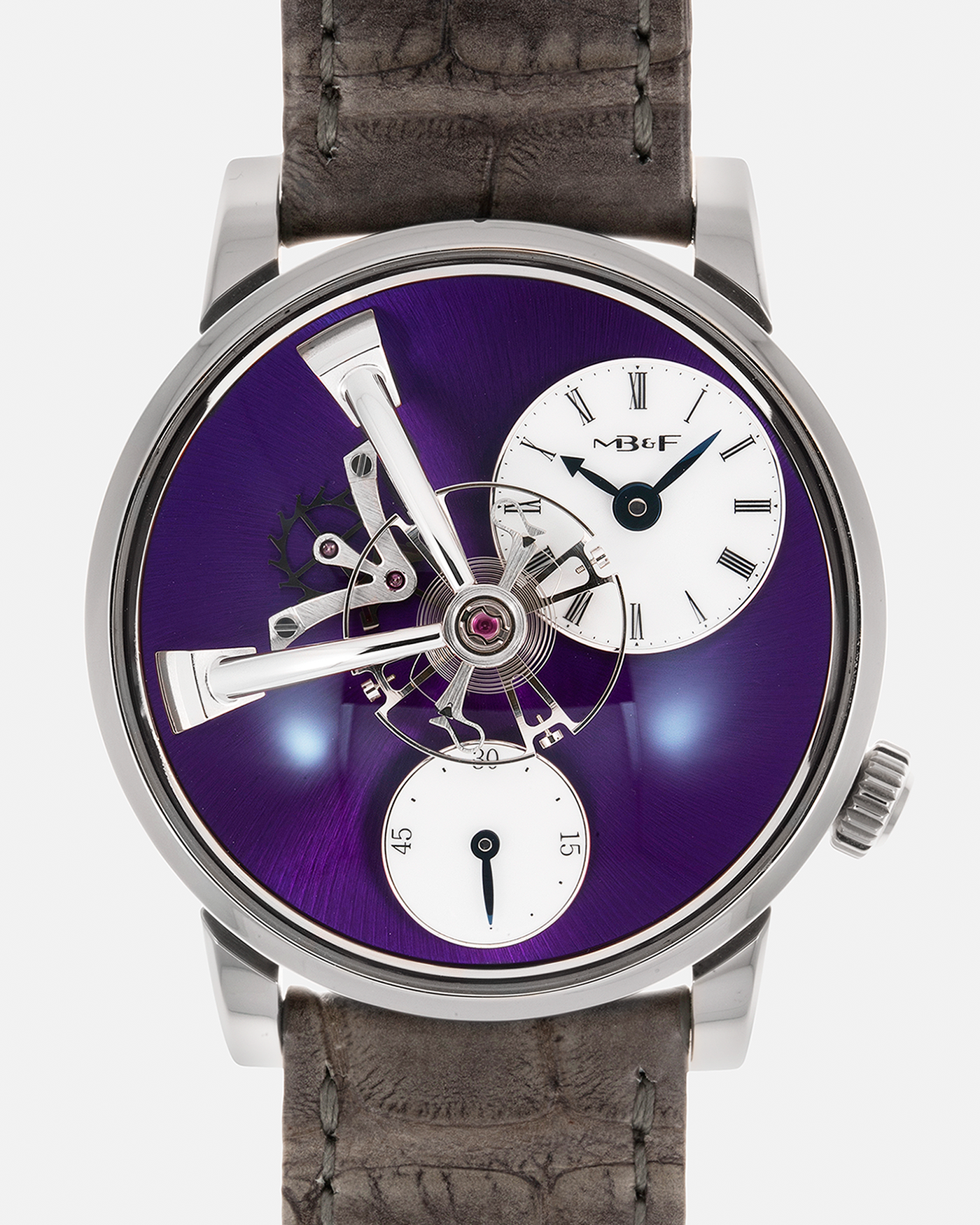 Brand: MB&F Year: 2022 Model: LM101 ‘White Gold Purple’ Reference: 51.W1L.W Material: 18-carat White Gold with Purple Baseplate Movement: In-House 3-Dimensional MB&F Caliber in Collaboration with Kari Voutilainen, Manual-Winding Case Diameter: 40mm Strap: MB&F Grey Alligator Strap and Signed Palladium Deployant Clasp, Additional MB&F Black Silicon Strap with Purple Stitching