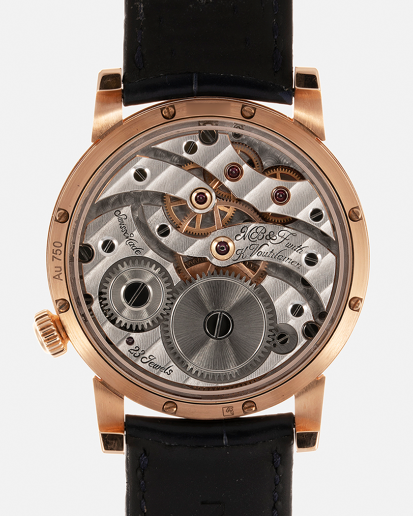 Brand: MB&F Year: 2022 Model: Legacy Machine 101 ‘Red Gold’ Reference: 51.RL.W Material: 18-carat Red Gold Movement: In-House 3-Dimensional MB&F Caliber in Collaboration with Kari Voutilainen, Manual-Winding Case Dimensions: 40mm x 16mm Lug Width: 21mm Strap: MB&F Dark Navy Alligator Strap and Signed Palladium Deployant Clasp