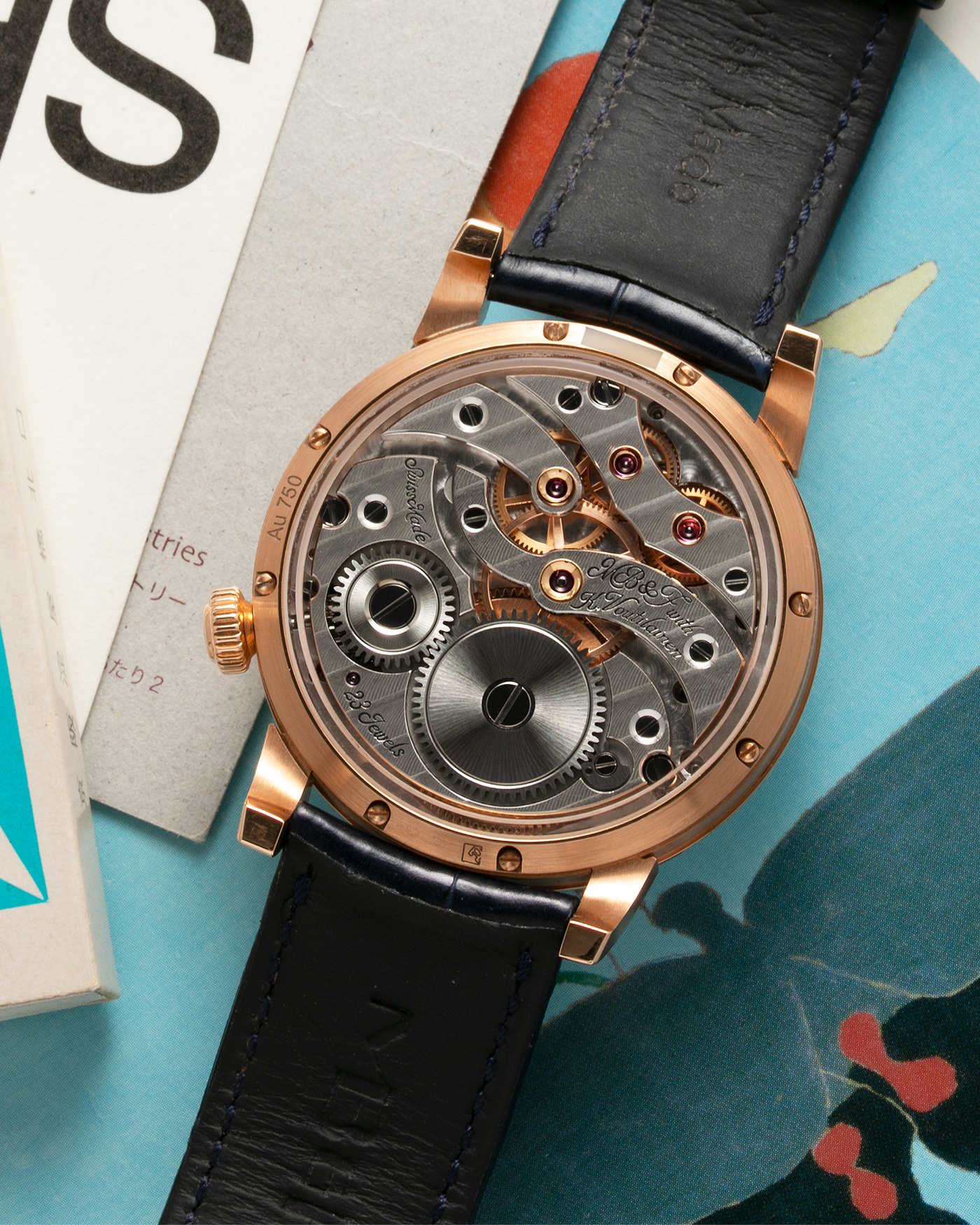 Brand: MB&F Year: 2022 Model: Legacy Machine 101 ‘Red Gold’ Reference: 51.RL.W Material: 18-carat Red Gold Movement: In-House 3-Dimensional MB&F Caliber in Collaboration with Kari Voutilainen, Manual-Winding Case Dimensions: 40mm x 16mm Lug Width: 21mm Strap: MB&F Dark Navy Alligator Strap and Signed Palladium Deployant Clasp