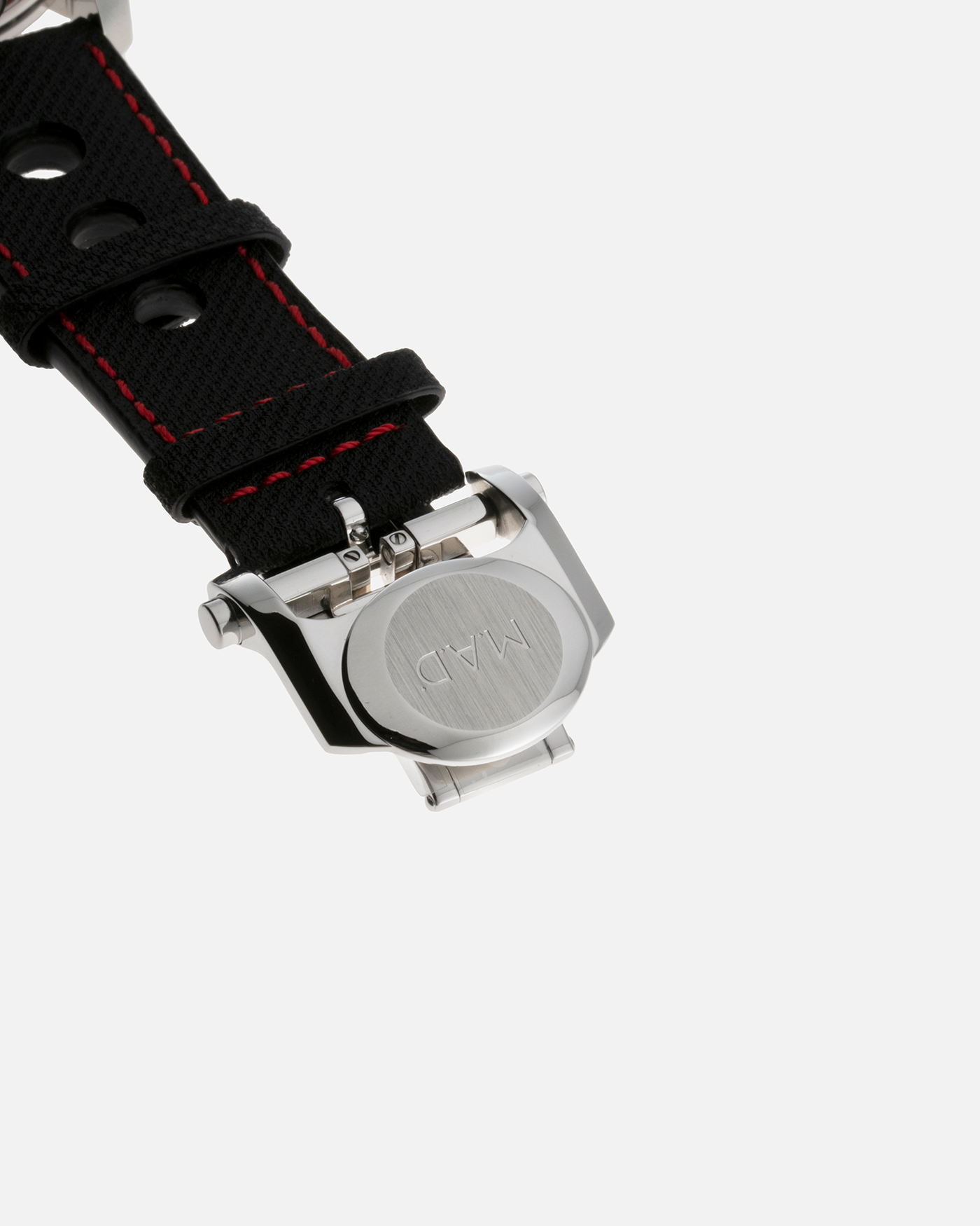 Brand: MB&F Year: 2022 Model: MAD 1 Material: Stainless Steel and Titanium Movement: Miyota Cal 821A Case Diameter: 42mm Bracelet/Strap: MB&F Black Calfskin Leather with Red Stitching and Stainless Steel Deployant Buckle