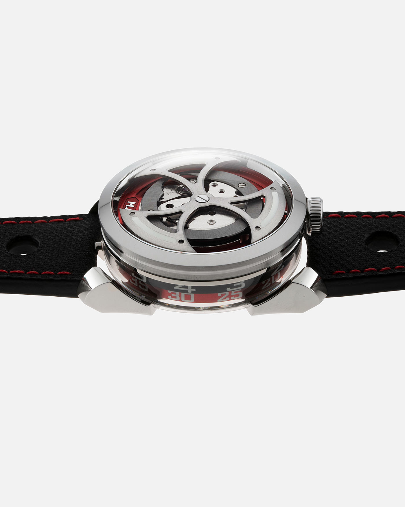 Brand: MB&F Year: 2022 Model: MAD 1 Material: Stainless Steel and Titanium Movement: Miyota Cal 821A Case Diameter: 42mm Bracelet/Strap: MB&F Black Calfskin Leather with Red Stitching and Stainless Steel Deployant Buckle