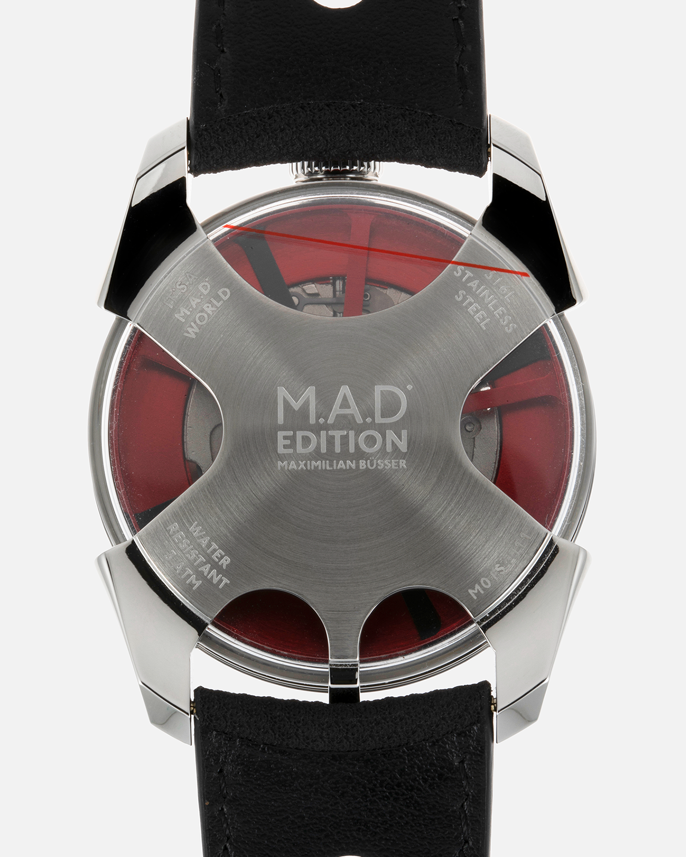 Brand: MB&F Year: 2022 Model: MAD 1 Material: Stainless Steel and Titanium Movement: Miyota Cal 821A Case Diameter: 42mm Bracelet/Strap: MB&F Black Calfskin Leather with Red Stitching and Stainless Steel Deployant Buckle
