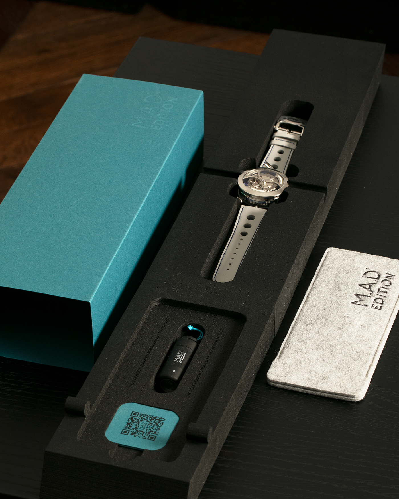 Brand: MB&F
Year: 2021
Model: MAD 1 Blue
Material: Stainless Steel and Titanium
Movement: Miyota Cal. 821A, Self-Winding
Case Dimensions: 42mm x 18.8mm (Lug-to-Lug 50.5mm)
Strap: MB&F White Grey Leather Rally Strap with Signed Stainless Steel Deployant 