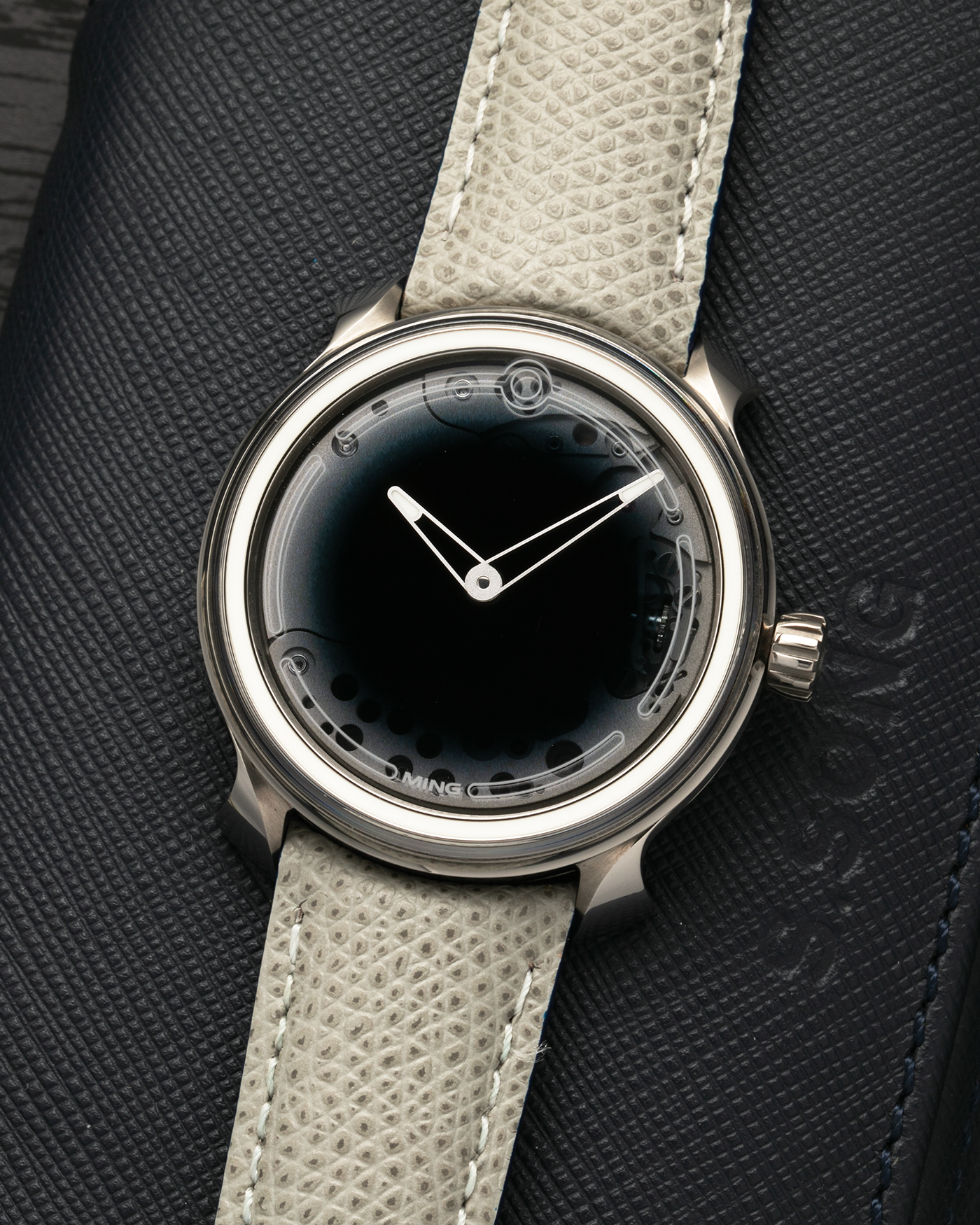 Brand: MING
Year: 2019
Model: 19.01
Material: Grade 5 Titanium
Movement: Schwarz-Etienne for MING Cal. MSE100.1, Manual-Winding
Case Dimensions: 39mm x 10.9mm (Lug-to-Lug 43mm)
Lug Width: 20mm
Strap: Jean Rousseau for MING Taupe Calf Leather Strap with Signed Grade 5 Titanium Tang Buckle