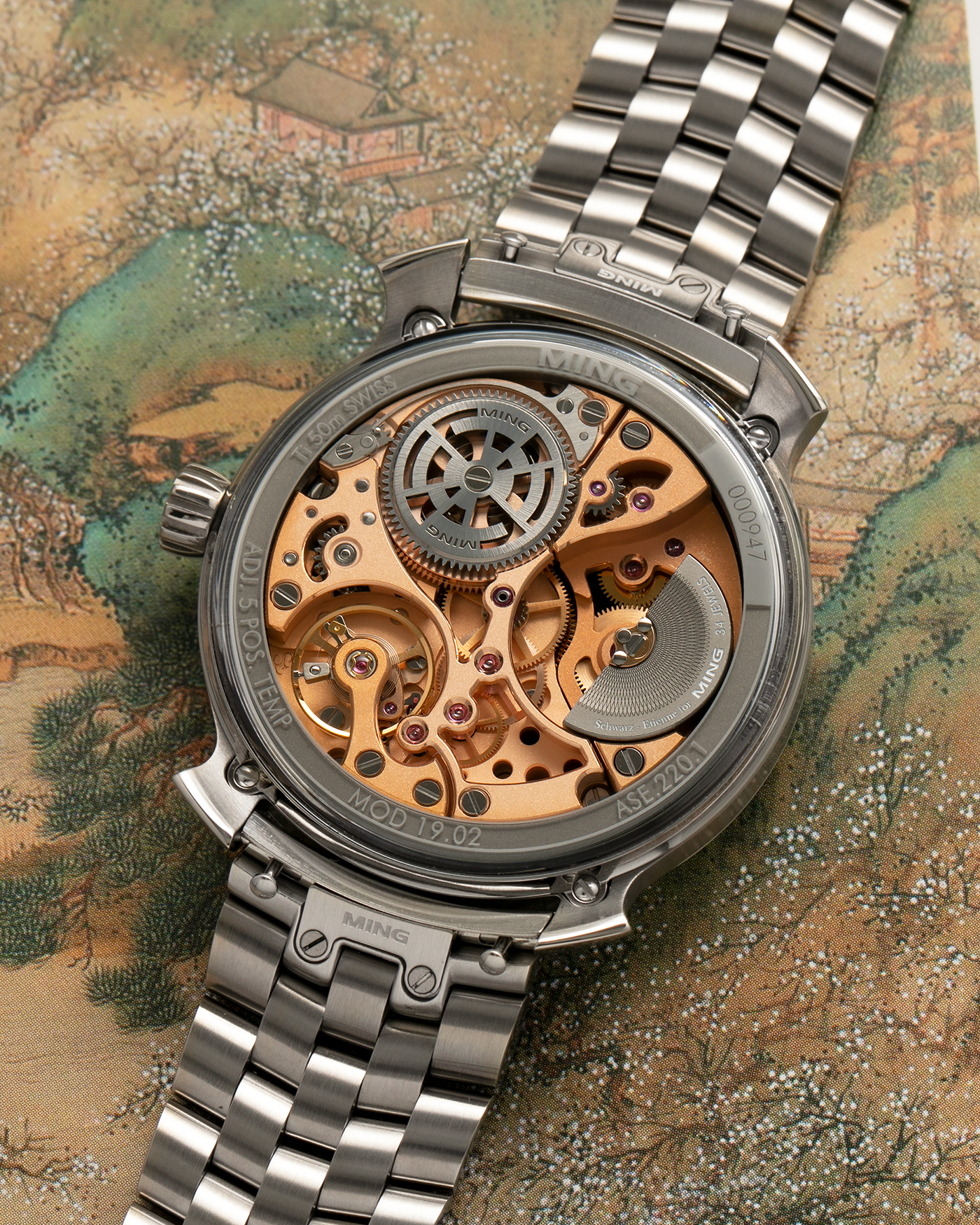 Brand: MING
Year: 2020
Model: 19.02 World Time
Material: Grade 5 Titanium
Movement: Schwarz-Etienne for MING Cal. ASE 220.1, Manual-Winding
Case Dimensions: 39mm x 10.9mm (Lug-to-Lug 43.9mm)
Lug Width: 20mm
Bracelet/Straps: MING Universal Bracelet in Stainless Steel and Titanium, with extra Jean Rousseau x MING Orange Calf, Brown Calf, Dark Brown Suede, Black Suede with Red Stitching Leather Straps