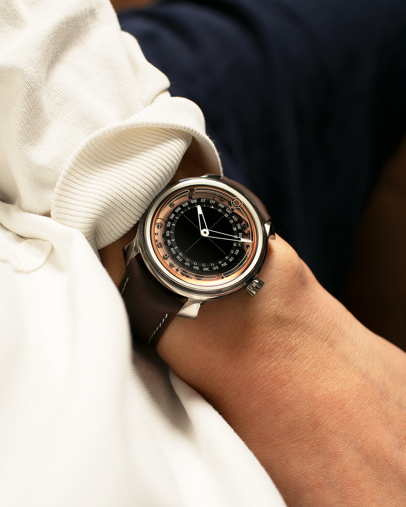 Brand: MING
Year: 2020
Model: 19.02 World Timer
Material: Grade 5 Titanium
Movement: Schwarz-Etienne for MING Cal. ASE 220.1, Manual-Winding
Case Dimensions: 39mm x 10.9mm (Lug-to-Lug 43.9mm)
Lug Width: 20mm
Straps: Jean Rousseau Brown Calf Leather Strap for MING with Signed Grade 5 Titanium Tang Buckle, additional Jean Rousseau Suede Black Leather Strap with Contrasting Orange Stitching for MING with Signed Grade 5 Titanium Tang Buckle