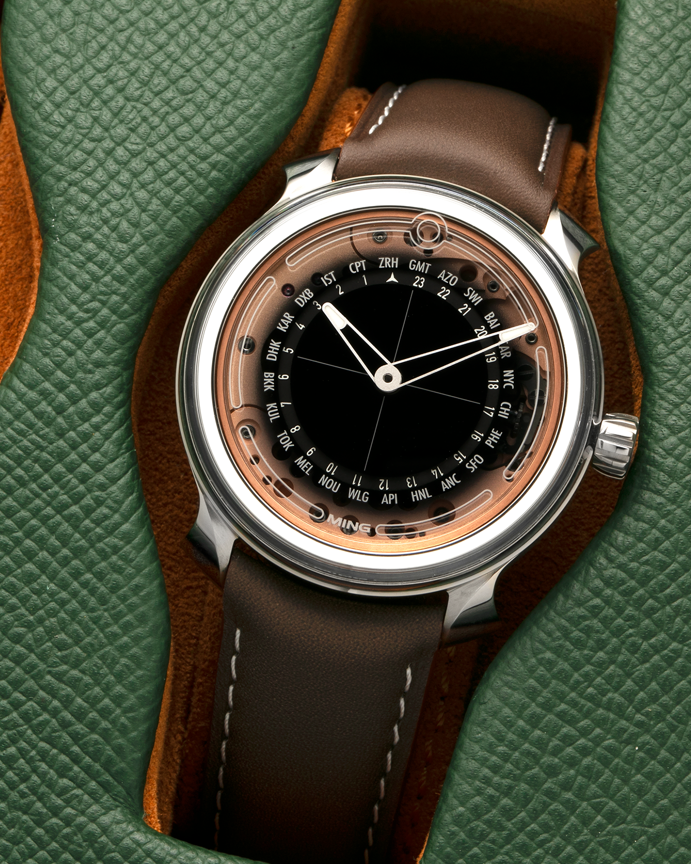 Brand: MING
Year: 2020
Model: 19.02 World Timer
Material: Grade 5 Titanium
Movement: Schwarz-Etienne for MING Cal. ASE 220.1, Manual-Winding
Case Dimensions: 39mm x 10.9mm (Lug-to-Lug 43.9mm)
Lug Width: 20mm
Straps: Jean Rousseau Brown Calf Leather Strap for MING with Signed Grade 5 Titanium Tang Buckle, additional Jean Rousseau Suede Black Leather Strap with Contrasting Orange Stitching for MING with Signed Grade 5 Titanium Tang Buckle