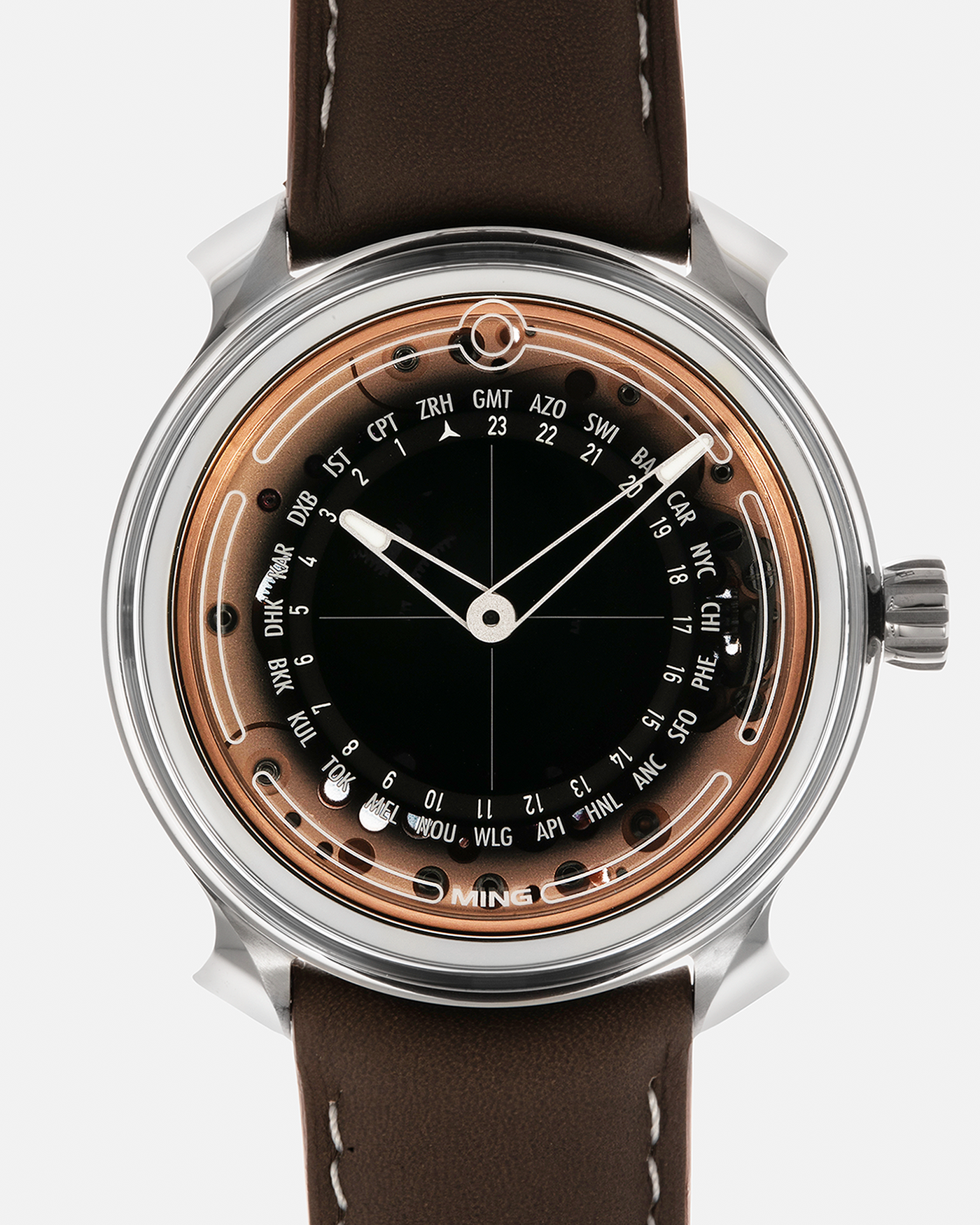 Brand: MING
Year: 2020
Model: 19.02 World Timer
Material: Grade 5 Titanium
Movement: Schwarz-Etienne for MING Cal. ASE 220.1, Manual-Winding
Case Dimensions: 39mm x 10.9mm (Lug-to-Lug 43.9mm)
Lug Width: 20mm
Straps: Jean Rousseau Brown Calf Leather Strap for MING with Signed Grade 5 Titanium Tang Buckle, additional Jean Rousseau Suede Black Leather Strap with Contrasting Orange Stitching for MING with Signed Grade 5 Titanium Tang Buckle