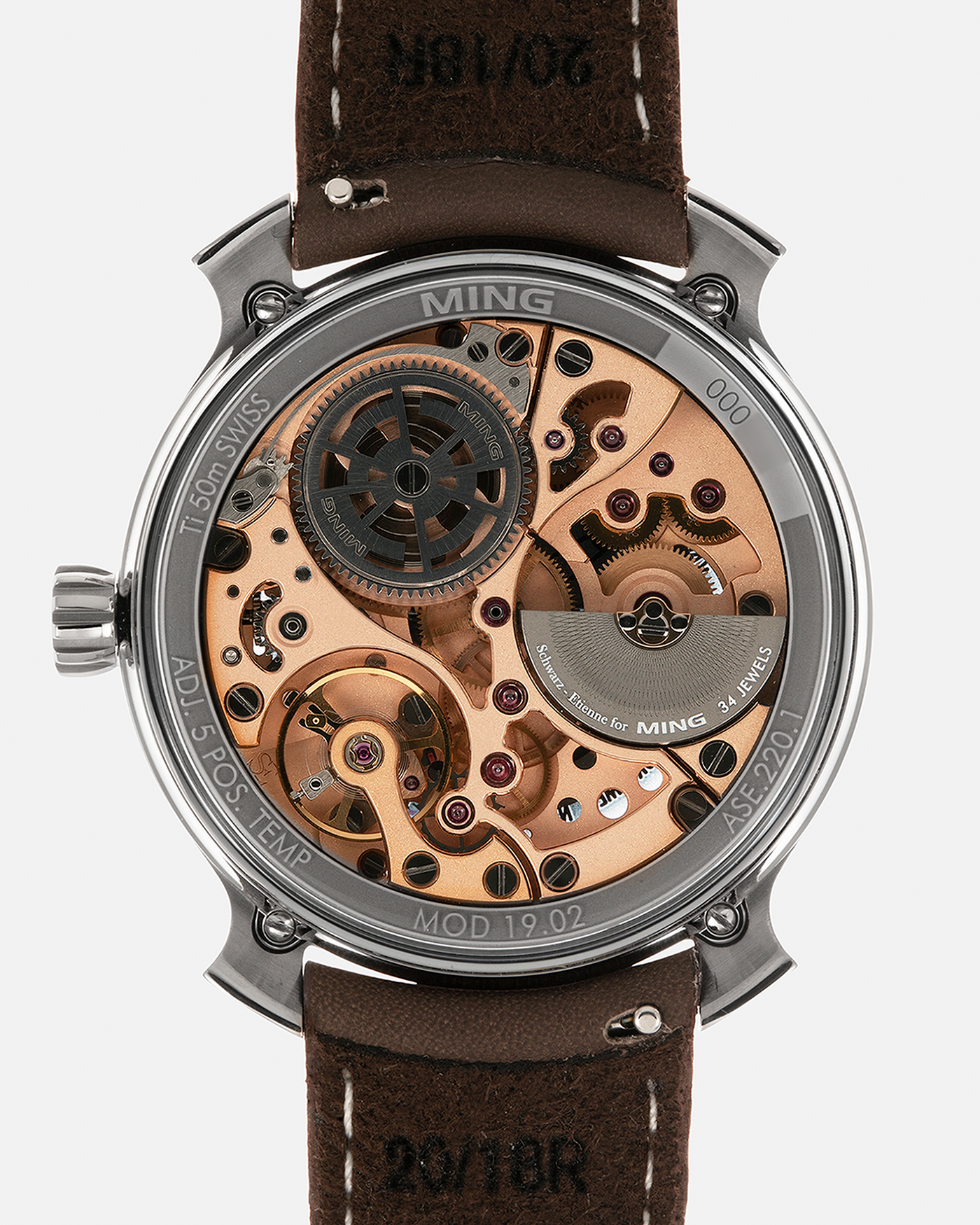 Brand: MING
Year: 2020
Model: 19.02 World Timer
Material: Grade 5 Titanium
Movement: Schwarz-Etienne for MING Cal. ASE 220.1, Manual-Winding
Case Dimensions: 39mm x 10.9mm (Lug-to-Lug 43.9mm)
Lug Width: 20mm
Straps: Jean Rousseau Brown Calf Leather Strap for MING with Signed Grade 5 Titanium Tang Buckle, additional Jean Rousseau Suede Black Leather Strap with Contrasting Orange Stitching for MING with Signed Grade 5 Titanium Tang Buckle