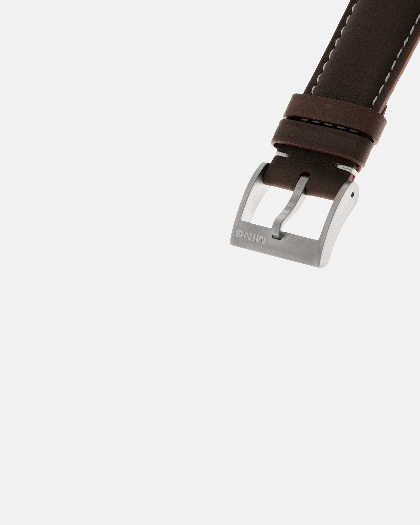 Brand: MING
Year: 2020
Model: 19.02 World Timer
Material: Grade 5 Titanium
Movement: Schwarz-Etienne for MING Cal. ASE 220.1, Manual-Winding
Case Dimensions: 39mm x 10.9mm (Lug-to-Lug 43.9mm)
Lug Width: 20mm
Straps: Jean Rousseau Brown Calf Leather Strap for MING with Signed Grade 5 Titanium Tang Buckle, additional Jean Rousseau Suede Black Leather Strap with Contrasting Orange Stitching for MING with Signed Grade 5 Titanium Tang Buckle