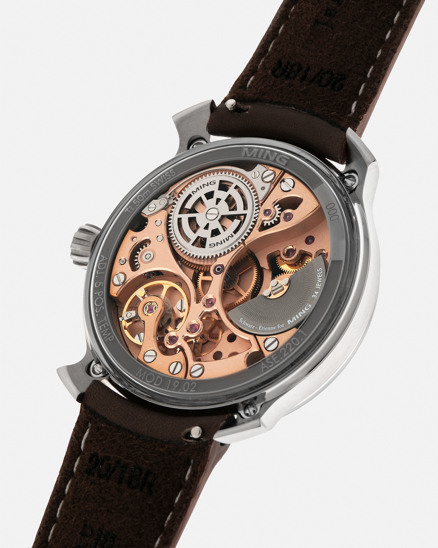 Brand: MING
Year: 2020
Model: 19.02 World Timer
Material: Grade 5 Titanium
Movement: Schwarz-Etienne for MING Cal. ASE 220.1, Manual-Winding
Case Dimensions: 39mm x 10.9mm (Lug-to-Lug 43.9mm)
Lug Width: 20mm
Straps: Jean Rousseau Brown Calf Leather Strap for MING with Signed Grade 5 Titanium Tang Buckle, additional Jean Rousseau Suede Black Leather Strap with Contrasting Orange Stitching for MING with Signed Grade 5 Titanium Tang Buckle