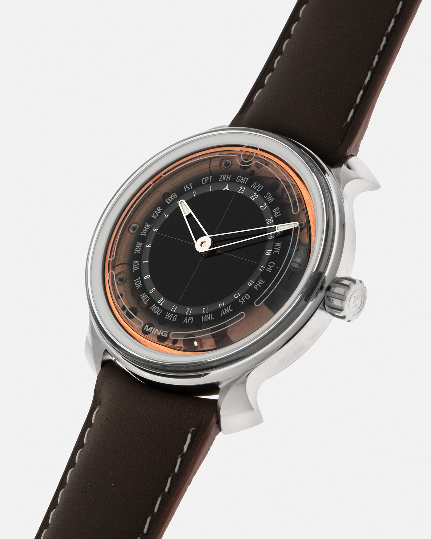 Brand: MING
Year: 2020
Model: 19.02 World Timer
Material: Grade 5 Titanium
Movement: Schwarz-Etienne for MING Cal. ASE 220.1, Manual-Winding
Case Dimensions: 39mm x 10.9mm (Lug-to-Lug 43.9mm)
Lug Width: 20mm
Straps: Jean Rousseau Brown Calf Leather Strap for MING with Signed Grade 5 Titanium Tang Buckle, additional Jean Rousseau Suede Black Leather Strap with Contrasting Orange Stitching for MING with Signed Grade 5 Titanium Tang Buckle