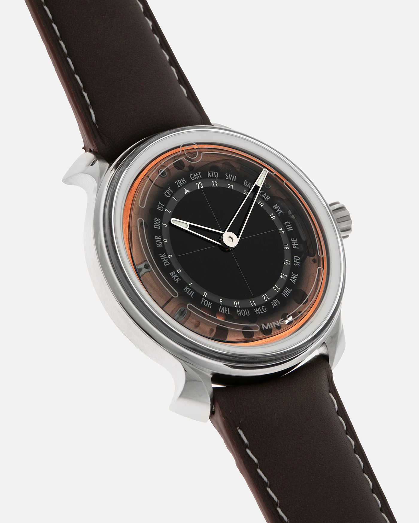 Brand: MING
Year: 2020
Model: 19.02 World Timer
Material: Grade 5 Titanium
Movement: Schwarz-Etienne for MING Cal. ASE 220.1, Manual-Winding
Case Dimensions: 39mm x 10.9mm (Lug-to-Lug 43.9mm)
Lug Width: 20mm
Straps: Jean Rousseau Brown Calf Leather Strap for MING with Signed Grade 5 Titanium Tang Buckle, additional Jean Rousseau Suede Black Leather Strap with Contrasting Orange Stitching for MING with Signed Grade 5 Titanium Tang Buckle