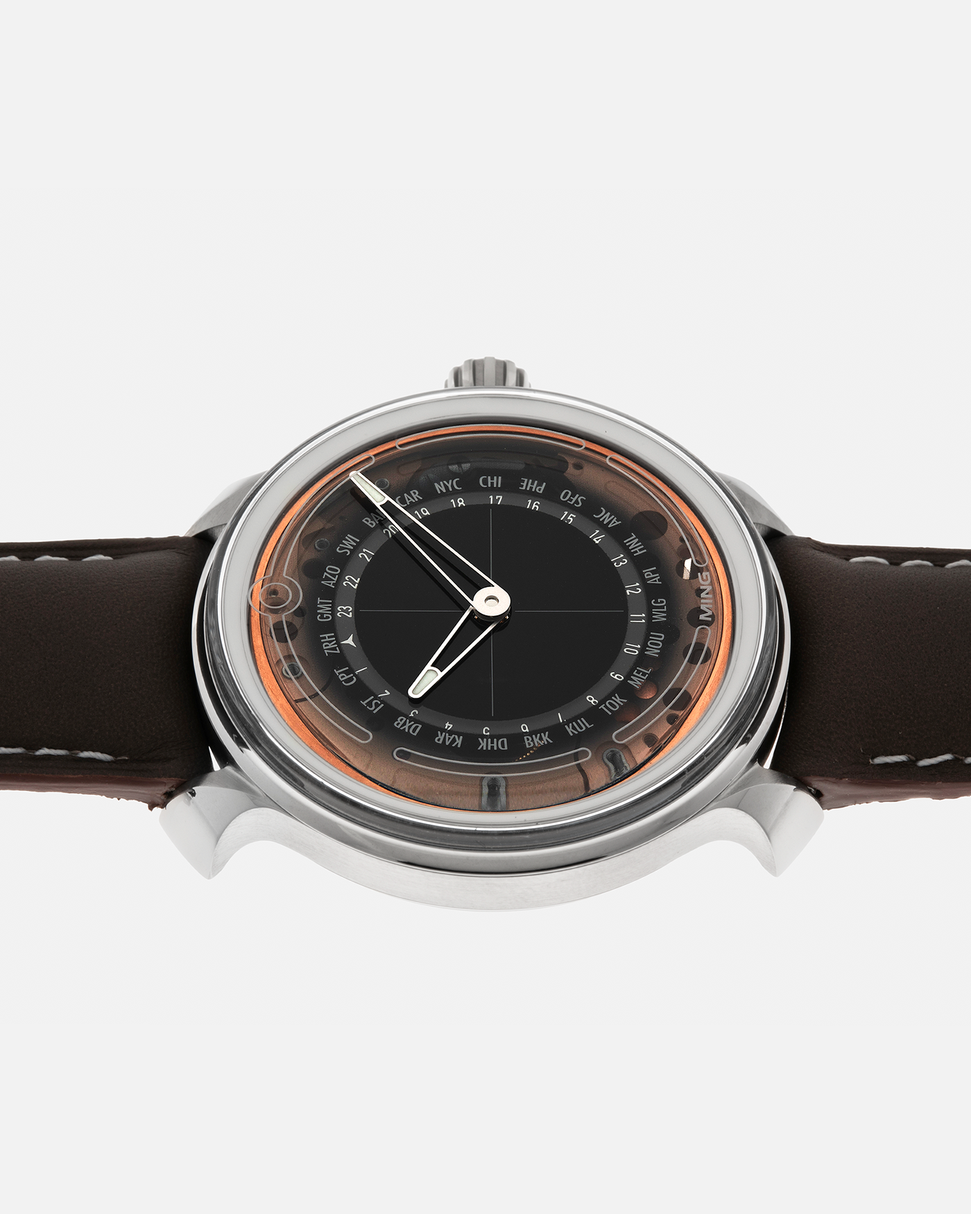 Brand: MING
Year: 2020
Model: 19.02 World Timer
Material: Grade 5 Titanium
Movement: Schwarz-Etienne for MING Cal. ASE 220.1, Manual-Winding
Case Dimensions: 39mm x 10.9mm (Lug-to-Lug 43.9mm)
Lug Width: 20mm
Straps: Jean Rousseau Brown Calf Leather Strap for MING with Signed Grade 5 Titanium Tang Buckle, additional Jean Rousseau Suede Black Leather Strap with Contrasting Orange Stitching for MING with Signed Grade 5 Titanium Tang Buckle