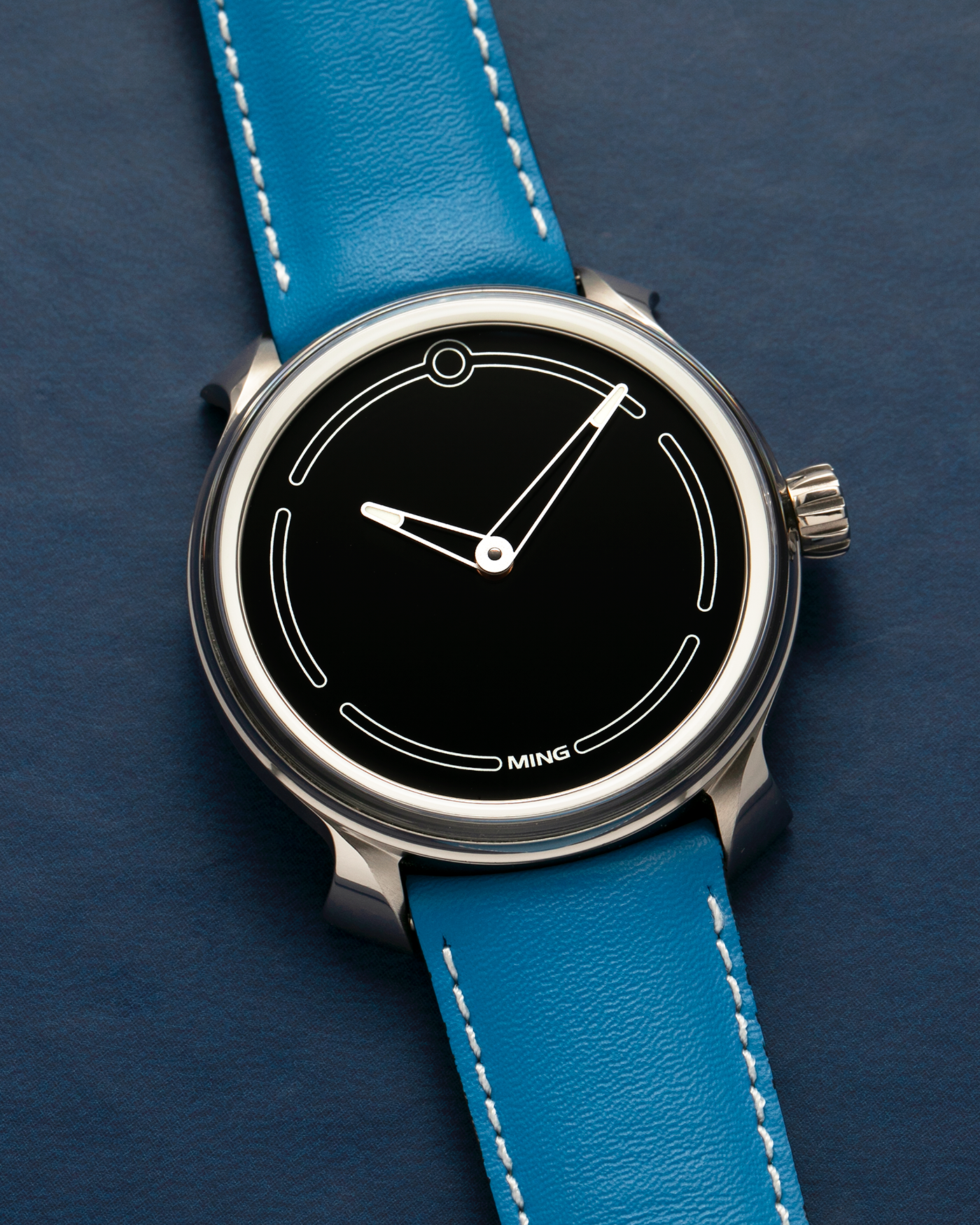 Brand: MING
Year: 2021
Model: 19.05, Limited to 15 Pieces
Material: Grade 5 Titanium
Movement: Schwarz-Etienne for MING Cal. ASE200.1, Manual-Winding
Case Dimensions: 39mm x 10.9mm (Lug-to-Lug 43mm)
Lug Width: 20mm
Strap/Bracelet: Jean Rousseau Sea Blue Calf Leather Strap for MING with Signed Grade 5 Titanium Tang Buckle, additional MING Universal Stainless Steel Bracelet