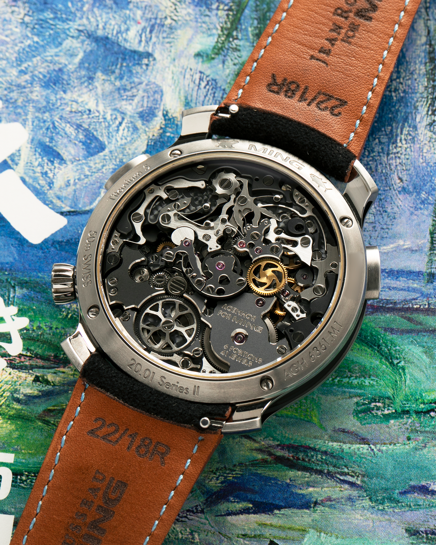 Brand: MING
Year: 2022
Model: 20.01 Series II ‘Special Projects Cave’, Limited to 50 pieces
Material: Grade 5 Titanium Case, DLC-Coated Case Band, Grade 2 Titanium Dial Base
Movement: Agenhor for MING Agengraphe Cal. 6361.M1, Manual-Winding
Case Dimensions: 41.5mm x 14.2mm (Lug-to-Lug 46mm)
Lug Width: 22mm
Strap: Jean Rousseau Black Suede Leather Strap with Orange Underlining for MING with Signed Grade 5 Titanium Keeperless Flying Blade Buckle