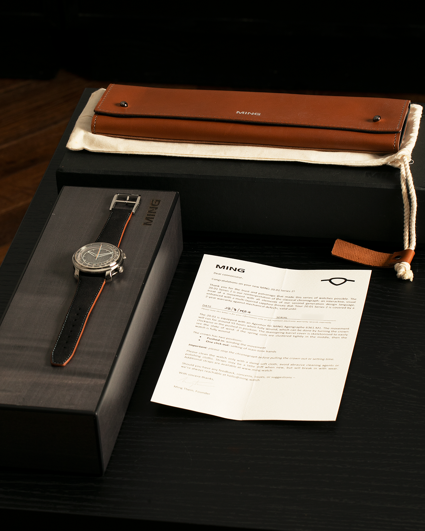 Brand: MING
Year: 2022
Model: 20.01 Series II ‘Special Projects Cave’, Limited to 50 pieces
Material: Grade 5 Titanium Case, DLC-Coated Case Band, Grade 2 Titanium Dial Base
Movement: Agenhor for MING Agengraphe Cal. 6361.M1, Manual-Winding
Case Dimensions: 41.5mm x 14.2mm (Lug-to-Lug 46mm)
Lug Width: 22mm
Strap: Jean Rousseau Black Suede Leather Strap with Orange Underlining for MING with Signed Grade 5 Titanium Keeperless Flying Blade Buckle