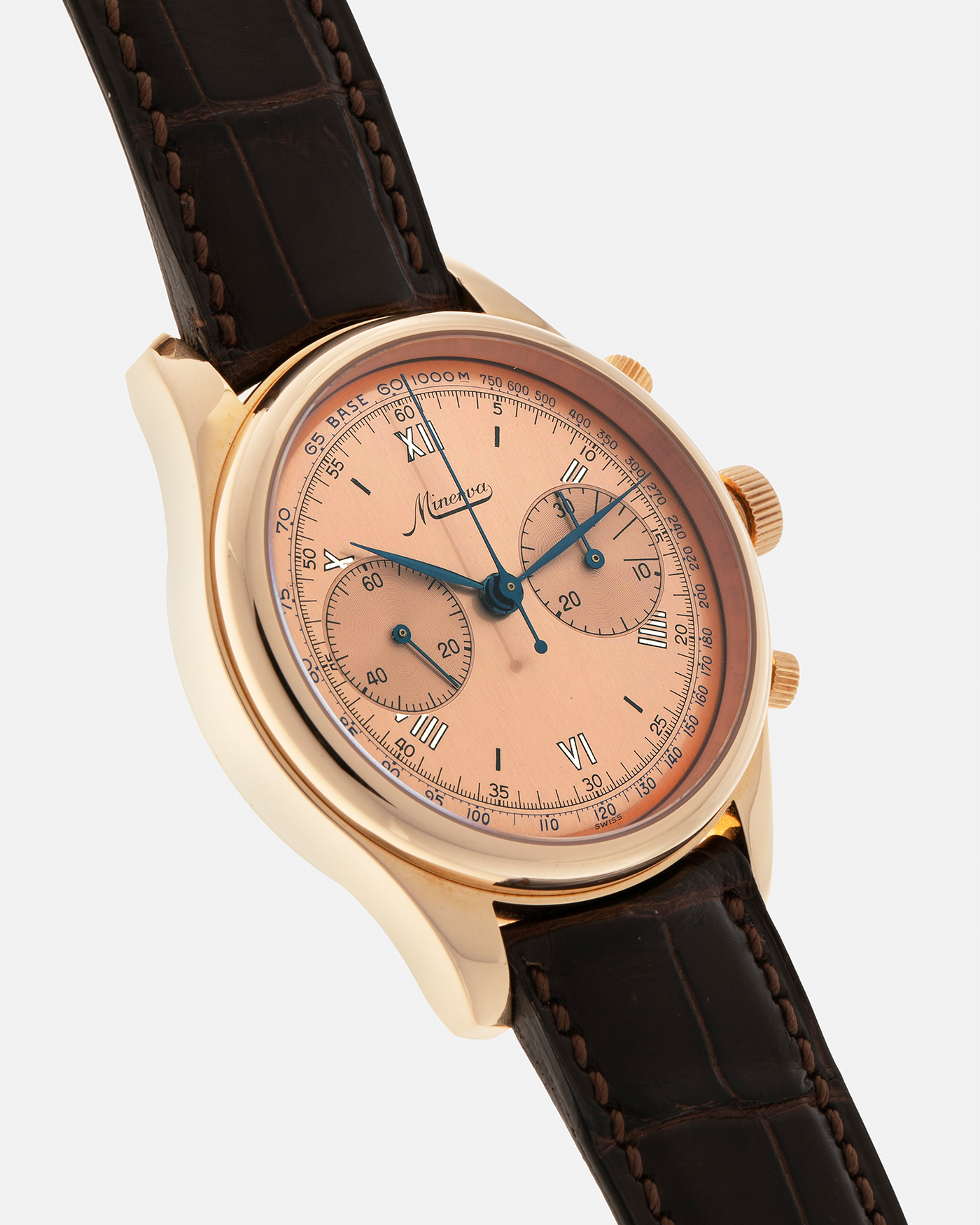 Brand: Minerva
Year: Early 2000s
Model: Chronograph ‘Salmon’
Reference Number: M132000
Material: 18-carat Rose Gold
Movement: Minerva Cal.13-20, Manual-Winding
Case Diameter: 40mm x 13mm (Lug-to-Lug 49mm)
Lug Width: 20mm
Strap: Minerva Dark Brown Alligator Leather Strap with Signed 18-carat Yellow Gold Tang Buckle