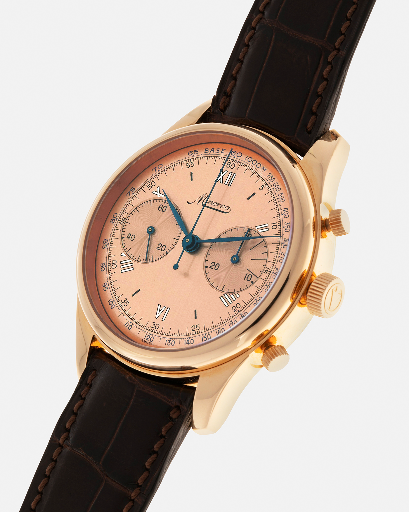 Brand: Minerva
Year: Early 2000s
Model: Chronograph ‘Salmon’
Reference Number: M132000
Material: 18-carat Rose Gold
Movement: Minerva Cal.13-20, Manual-Winding
Case Diameter: 40mm x 13mm (Lug-to-Lug 49mm)
Lug Width: 20mm
Strap: Minerva Dark Brown Alligator Leather Strap with Signed 18-carat Yellow Gold Tang Buckle