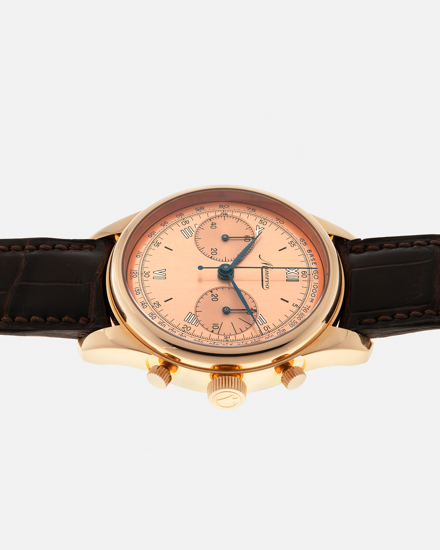Brand: Minerva
Year: Early 2000s
Model: Chronograph ‘Salmon’
Reference Number: M132000
Material: 18-carat Rose Gold
Movement: Minerva Cal.13-20, Manual-Winding
Case Diameter: 40mm x 13mm (Lug-to-Lug 49mm)
Lug Width: 20mm
Strap: Minerva Dark Brown Alligator Leather Strap with Signed 18-carat Yellow Gold Tang Buckle