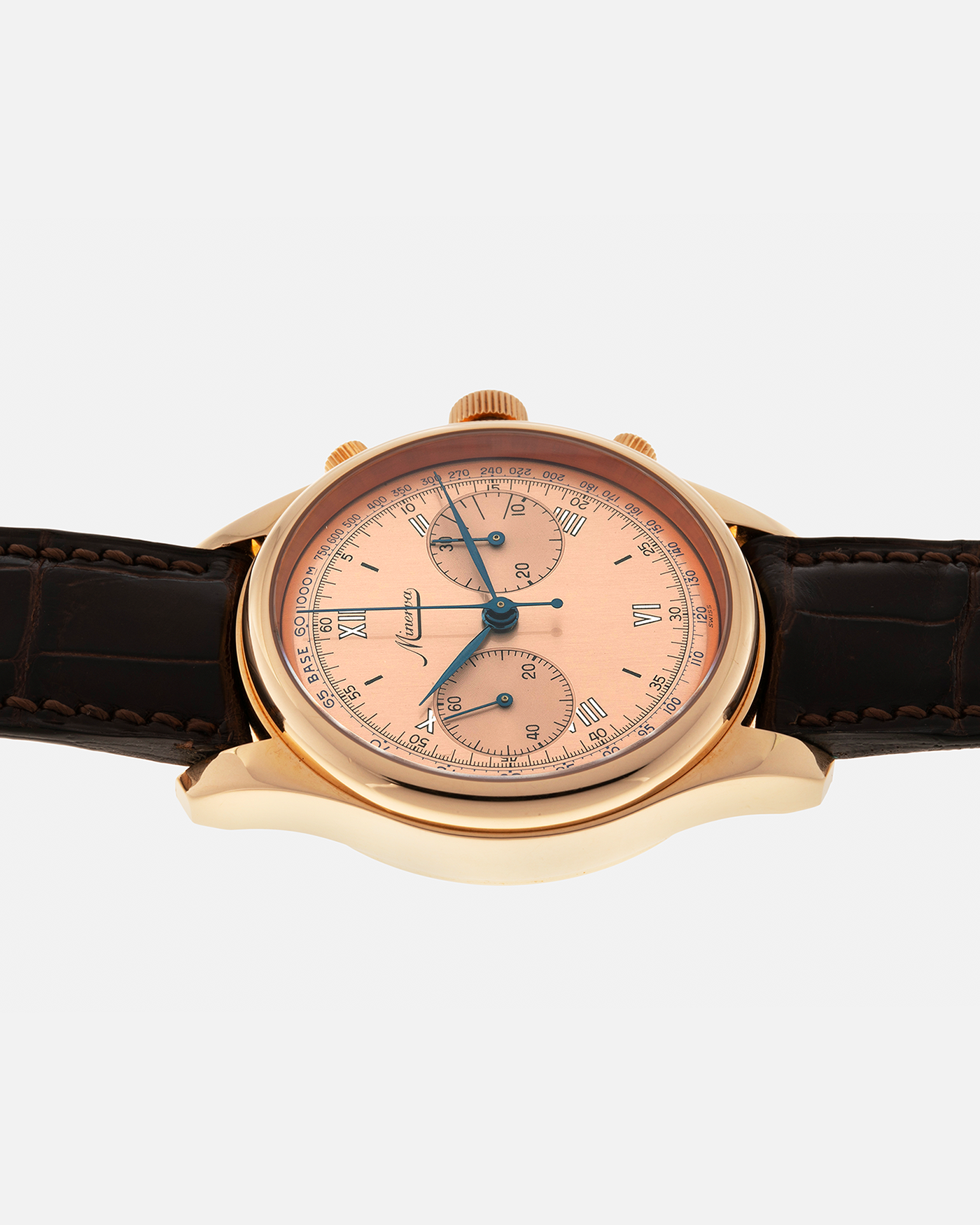Brand: Minerva
Year: Early 2000s
Model: Chronograph ‘Salmon’
Reference Number: M132000
Material: 18-carat Rose Gold
Movement: Minerva Cal.13-20, Manual-Winding
Case Diameter: 40mm x 13mm (Lug-to-Lug 49mm)
Lug Width: 20mm
Strap: Minerva Dark Brown Alligator Leather Strap with Signed 18-carat Yellow Gold Tang Buckle