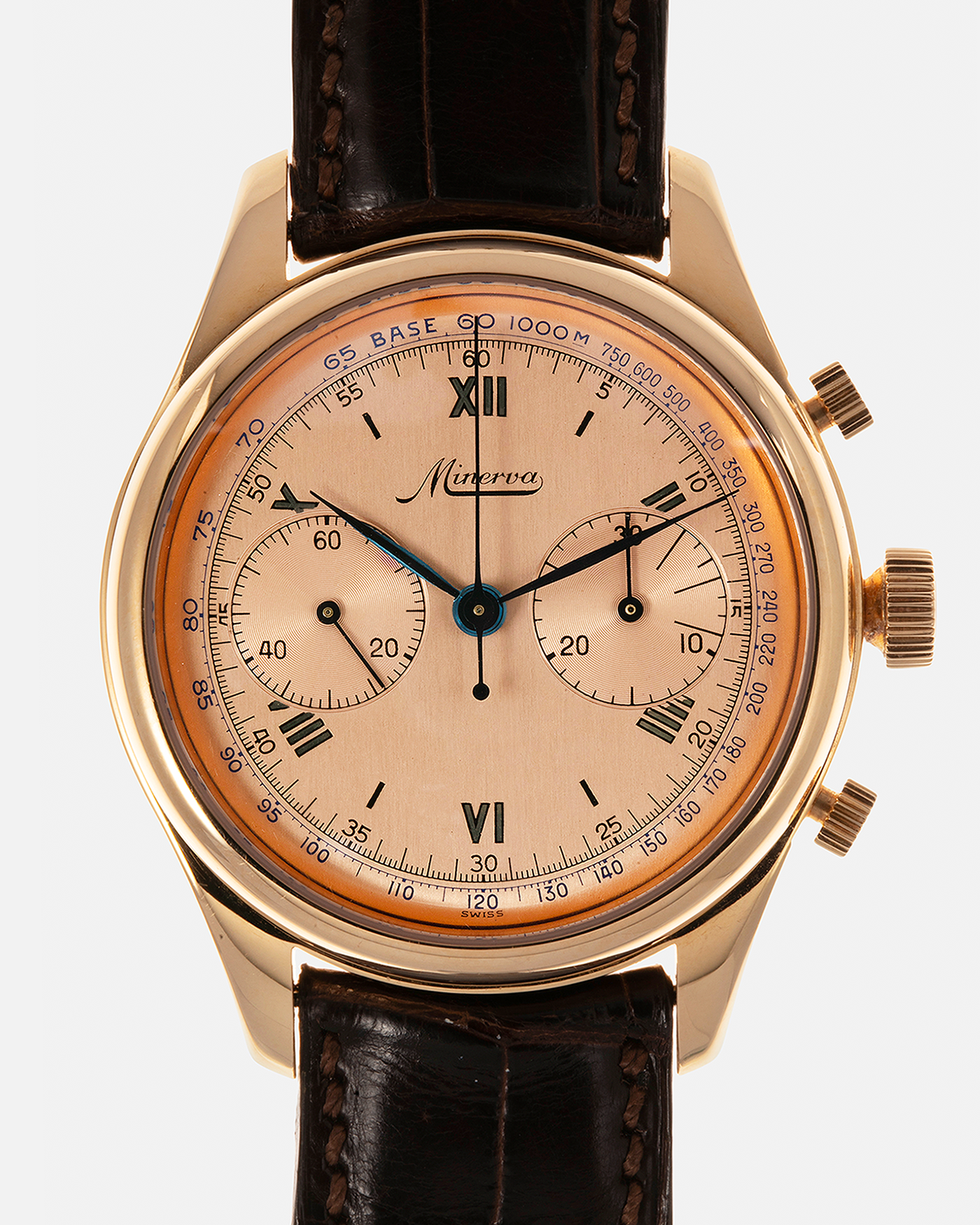 Brand: Minerva
Year: Early 2000s
Model: Chronograph ‘Salmon’
Reference Number: M132000
Material: 18-carat Rose Gold
Movement: Minerva Cal.13-20, Manual-Winding
Case Diameter: 40mm x 13mm (Lug-to-Lug 49mm)
Lug Width: 20mm
Strap: Minerva Dark Brown Alligator Leather Strap with Signed 18-carat Yellow Gold Tang Buckle