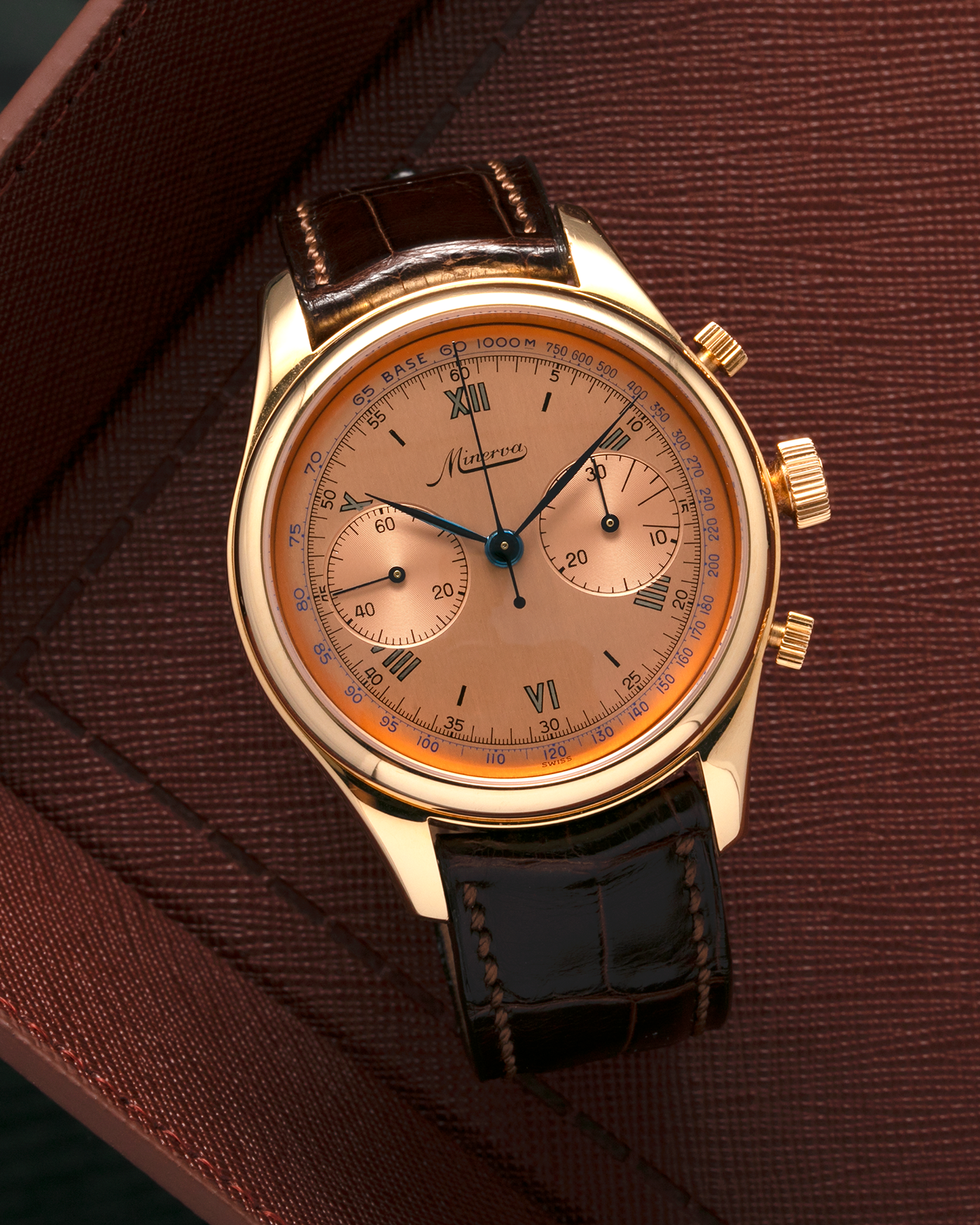 Brand: Minerva
Year: Early 2000s
Model: Chronograph ‘Salmon’
Reference Number: M132000
Material: 18-carat Rose Gold
Movement: Minerva Cal.13-20, Manual-Winding
Case Diameter: 40mm x 13mm (Lug-to-Lug 49mm)
Lug Width: 20mm
Strap: Minerva Dark Brown Alligator Leather Strap with Signed 18-carat Yellow Gold Tang Buckle