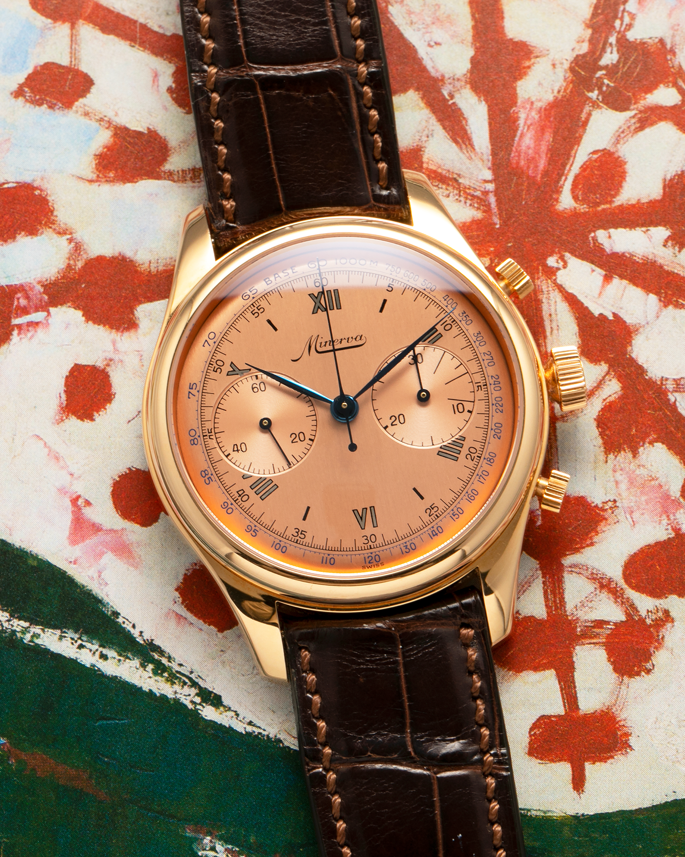 Brand: Minerva
Year: Early 2000s
Model: Chronograph ‘Salmon’
Reference Number: M132000
Material: 18-carat Rose Gold
Movement: Minerva Cal.13-20, Manual-Winding
Case Diameter: 40mm x 13mm (Lug-to-Lug 49mm)
Lug Width: 20mm
Strap: Minerva Dark Brown Alligator Leather Strap with Signed 18-carat Yellow Gold Tang Buckle