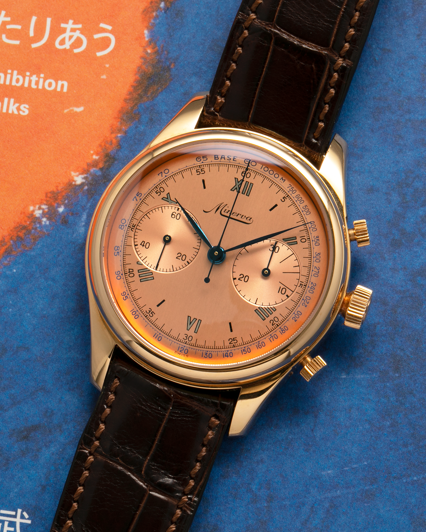 Brand: Minerva
Year: Early 2000s
Model: Chronograph ‘Salmon’
Reference Number: M132000
Material: 18-carat Rose Gold
Movement: Minerva Cal.13-20, Manual-Winding
Case Diameter: 40mm x 13mm (Lug-to-Lug 49mm)
Lug Width: 20mm
Strap: Minerva Dark Brown Alligator Leather Strap with Signed 18-carat Yellow Gold Tang Buckle