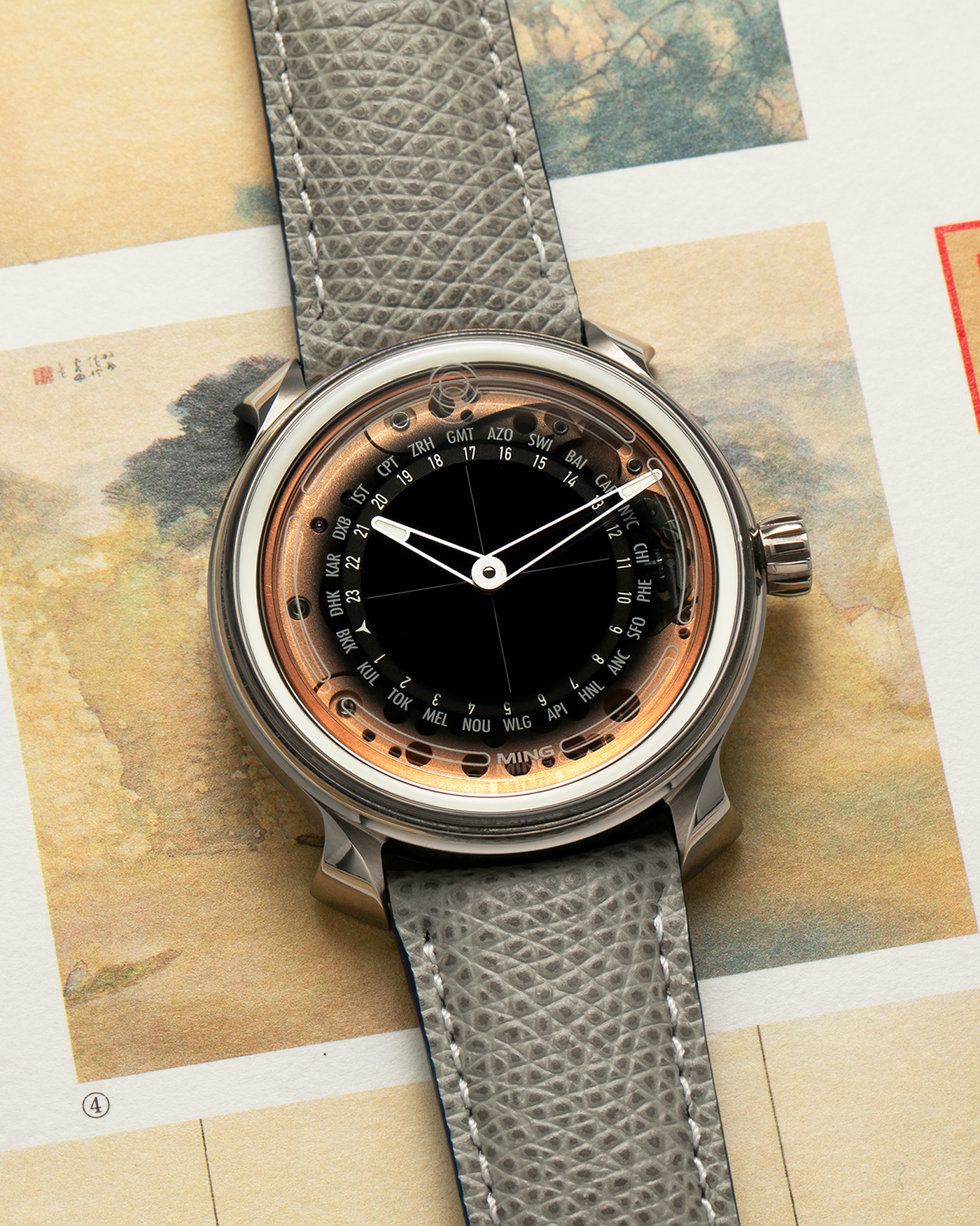 Brand: MING
Year: 2020
Model: 19.02 World Timer
Material: Grade 5 Titanium
Movement: Schwarz-Etienne for MING Cal. ASE 220.1, Manual-Winding
Case Dimensions: 39mm x 10.9mm (Lug-to-Lug 43.9mm)
Lug Width: 20mm
Strap: Jean Rousseau for MING Grey Calf Leather Strap with Signed Grade 5 Titanium Tang Buckle
