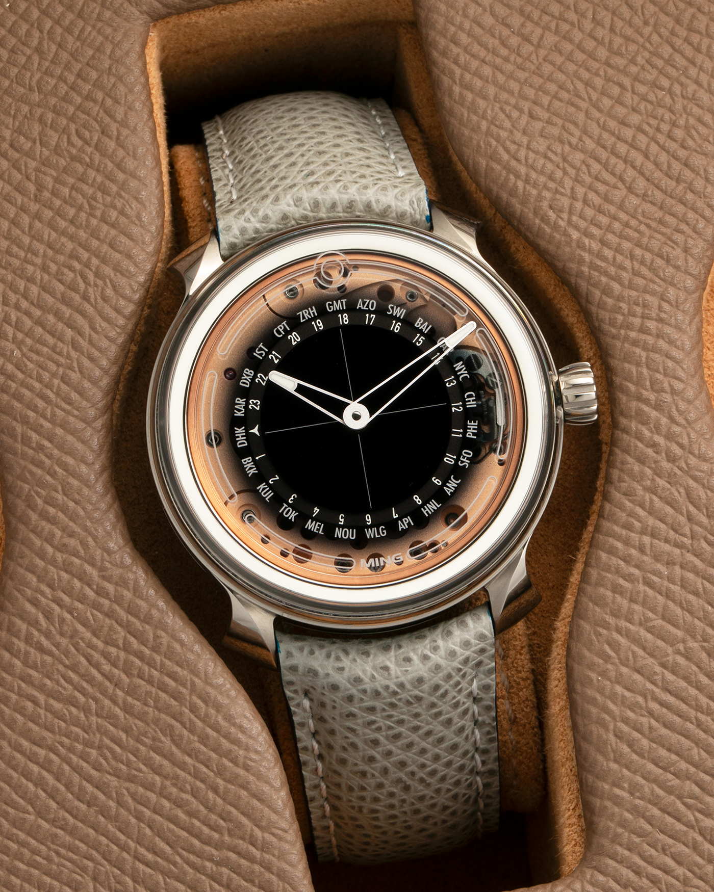 Brand: MING
Year: 2020
Model: 19.02 World Timer
Material: Grade 5 Titanium
Movement: Schwarz-Etienne for MING Cal. ASE 220.1, Manual-Winding
Case Dimensions: 39mm x 10.9mm (Lug-to-Lug 43.9mm)
Lug Width: 20mm
Strap: Jean Rousseau for MING Grey Calf Leather Strap with Signed Grade 5 Titanium Tang Buckle